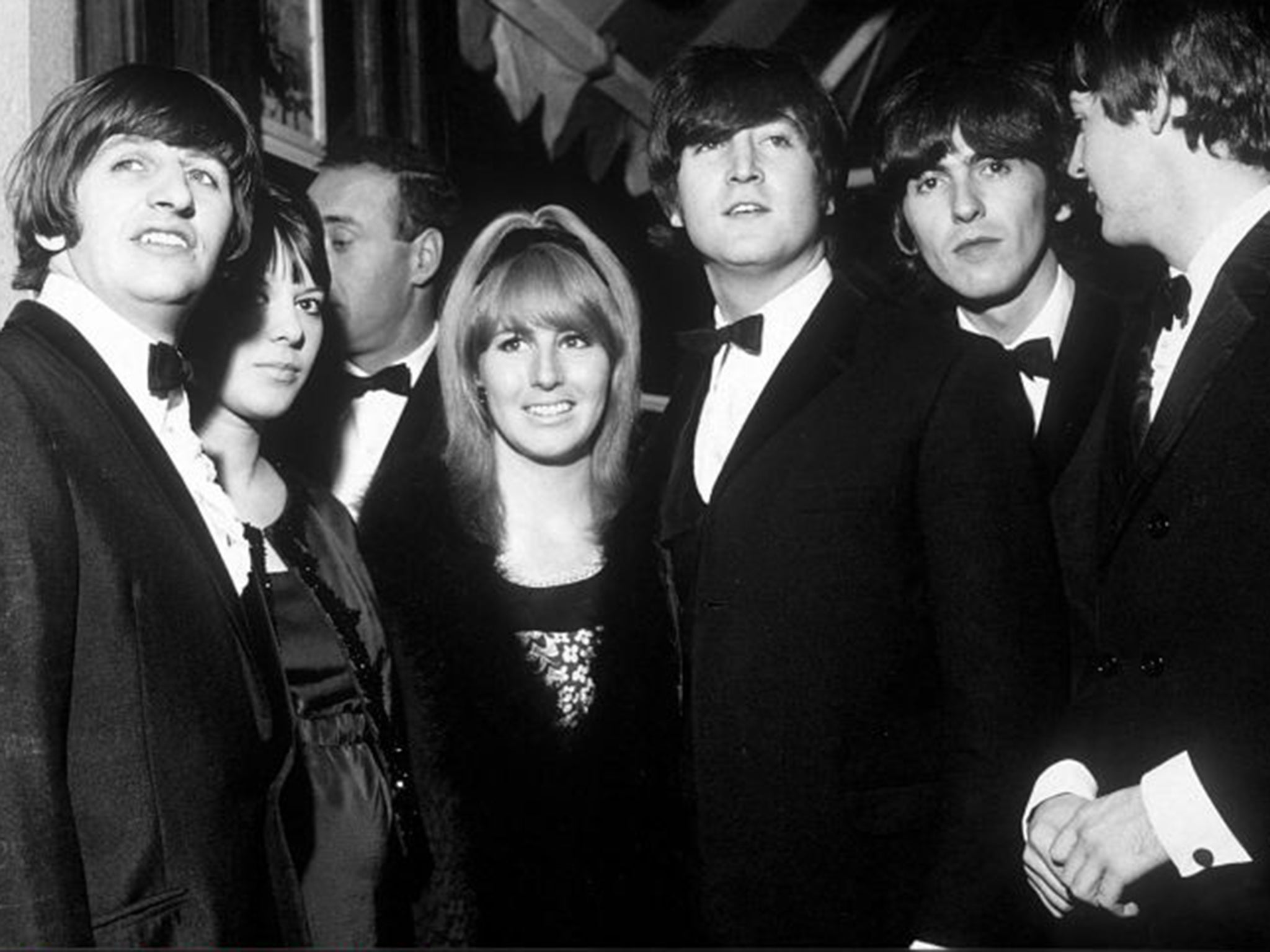 Eye of the storm: Lennon, centre, with the Beatles (and Ringo's wife Maureen)  at the premiere of 'A Hard Day’s Night' in 1964
