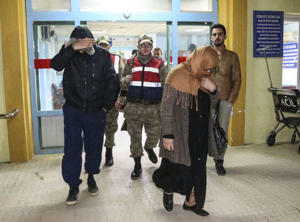 Detained Britons people leave an hospital after they undergo medical check up and fingerprinting in Hatay, southern  Turkey 