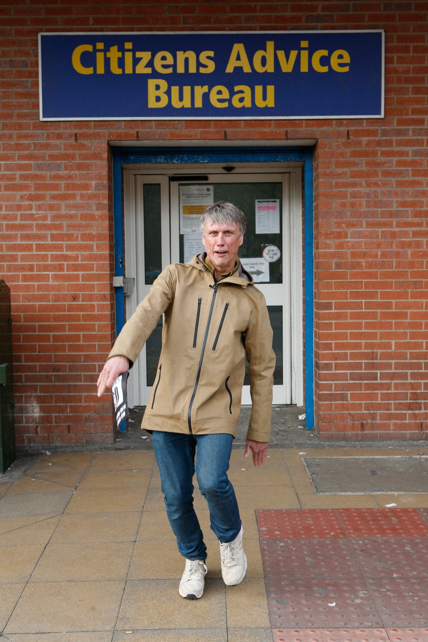 The former Happy Mondays dancer strikes a pose with his Party pamphlet in Salford