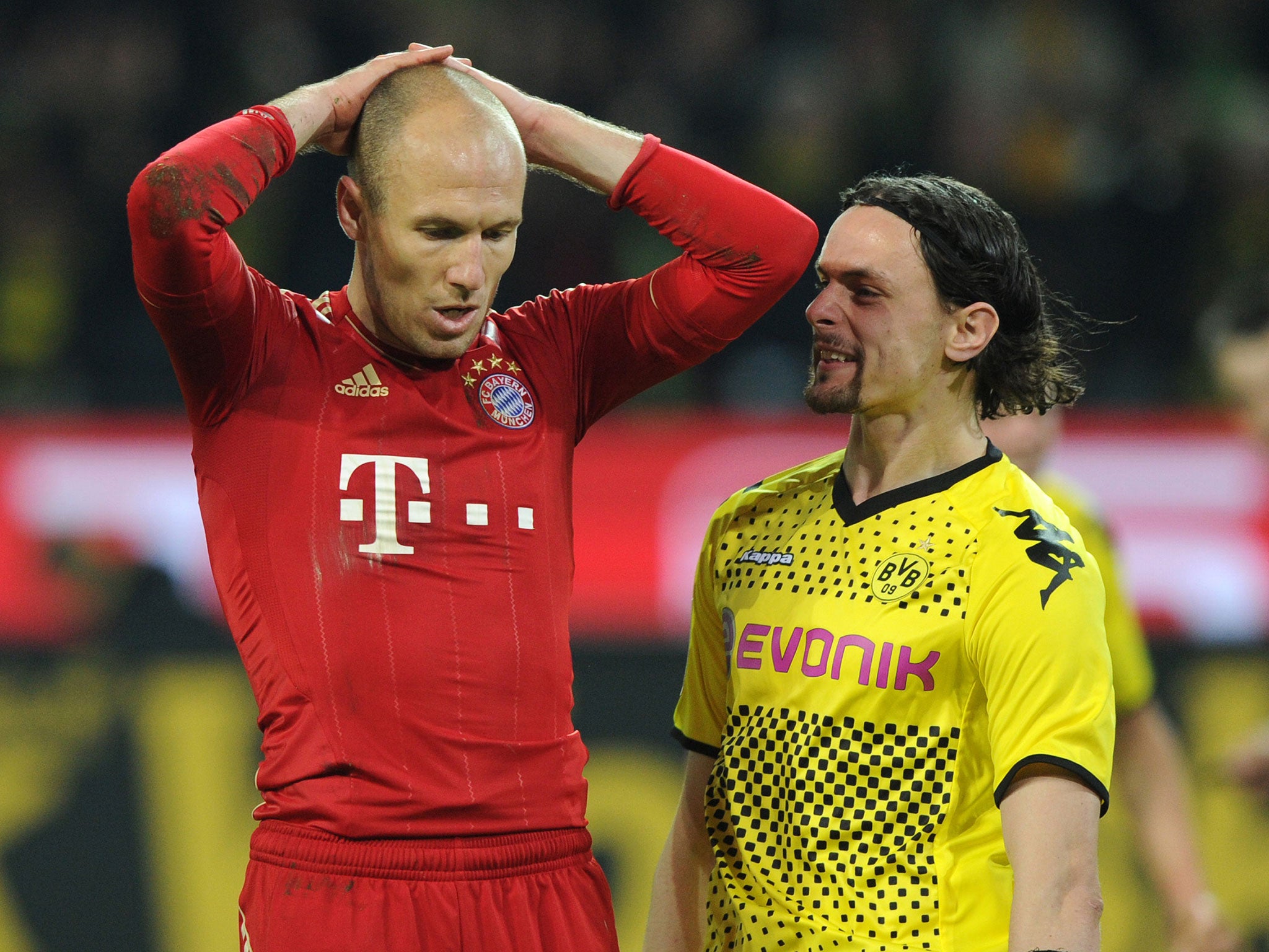 Arjen Robben is taunted by Borussia Dortmund