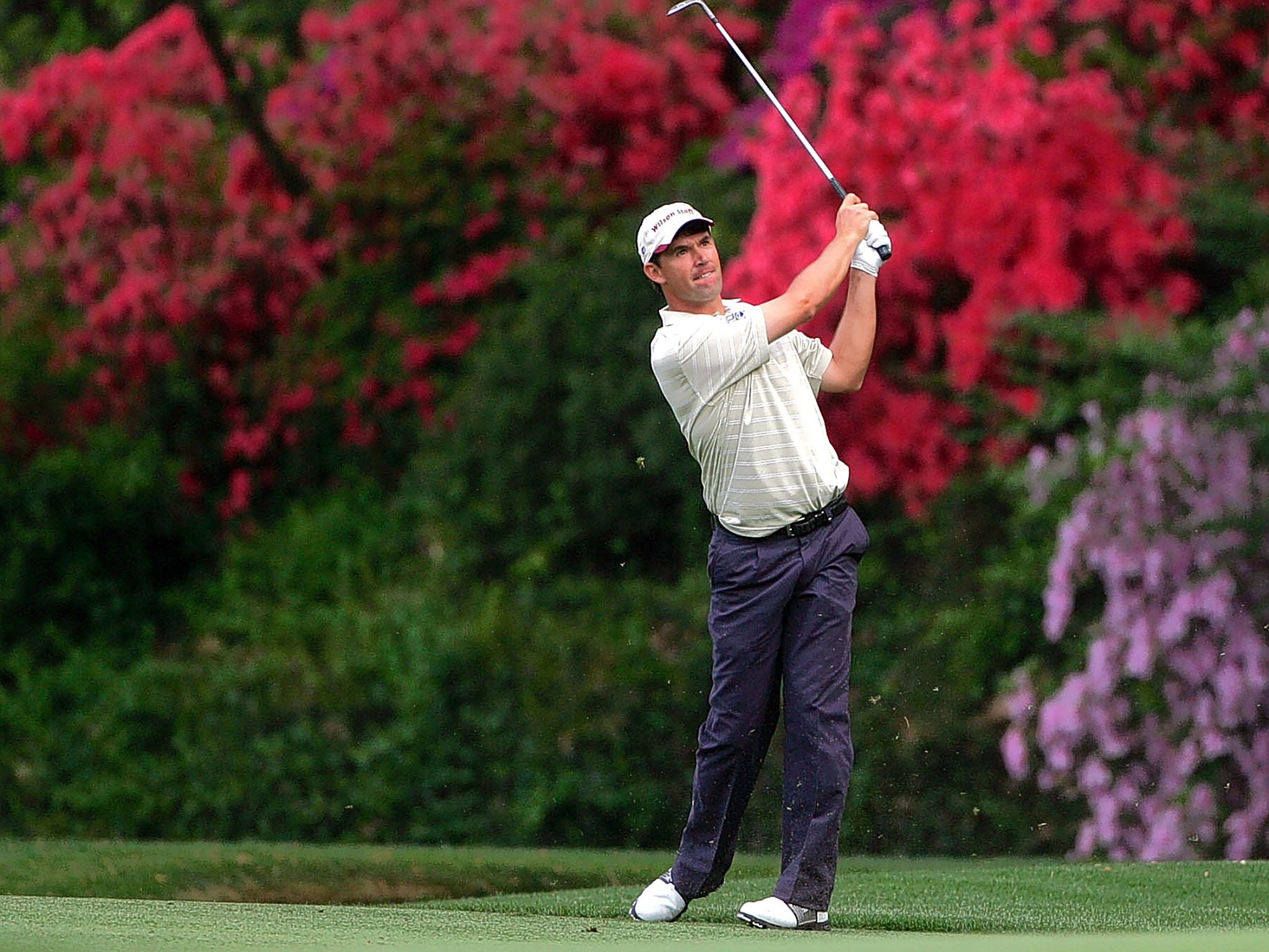 Padraig Harrington plays his tee shot on the 13th hole during the first day of the Masters in 2002