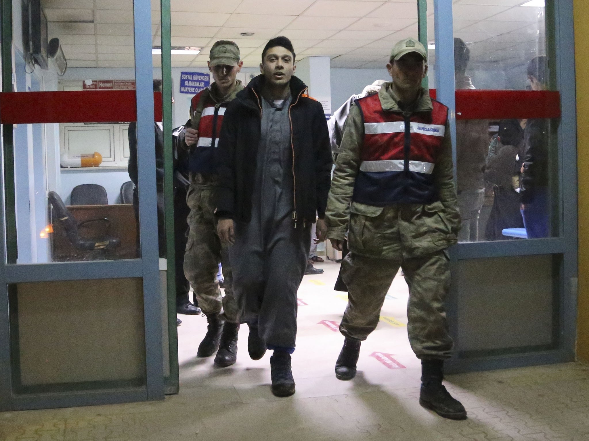 One of the Britons detained for allegedly trying to cross into Syria leaves hospital in Hatay,
Turkey, yesterday