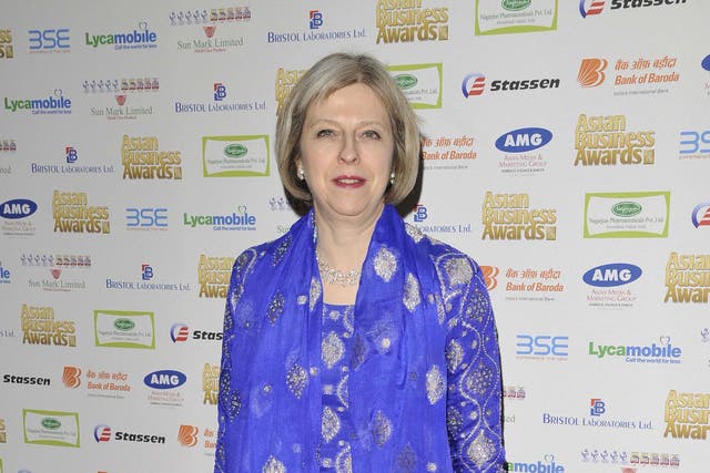 Out of the blue: Theresa May at the Asian Business Awards in London on Monday