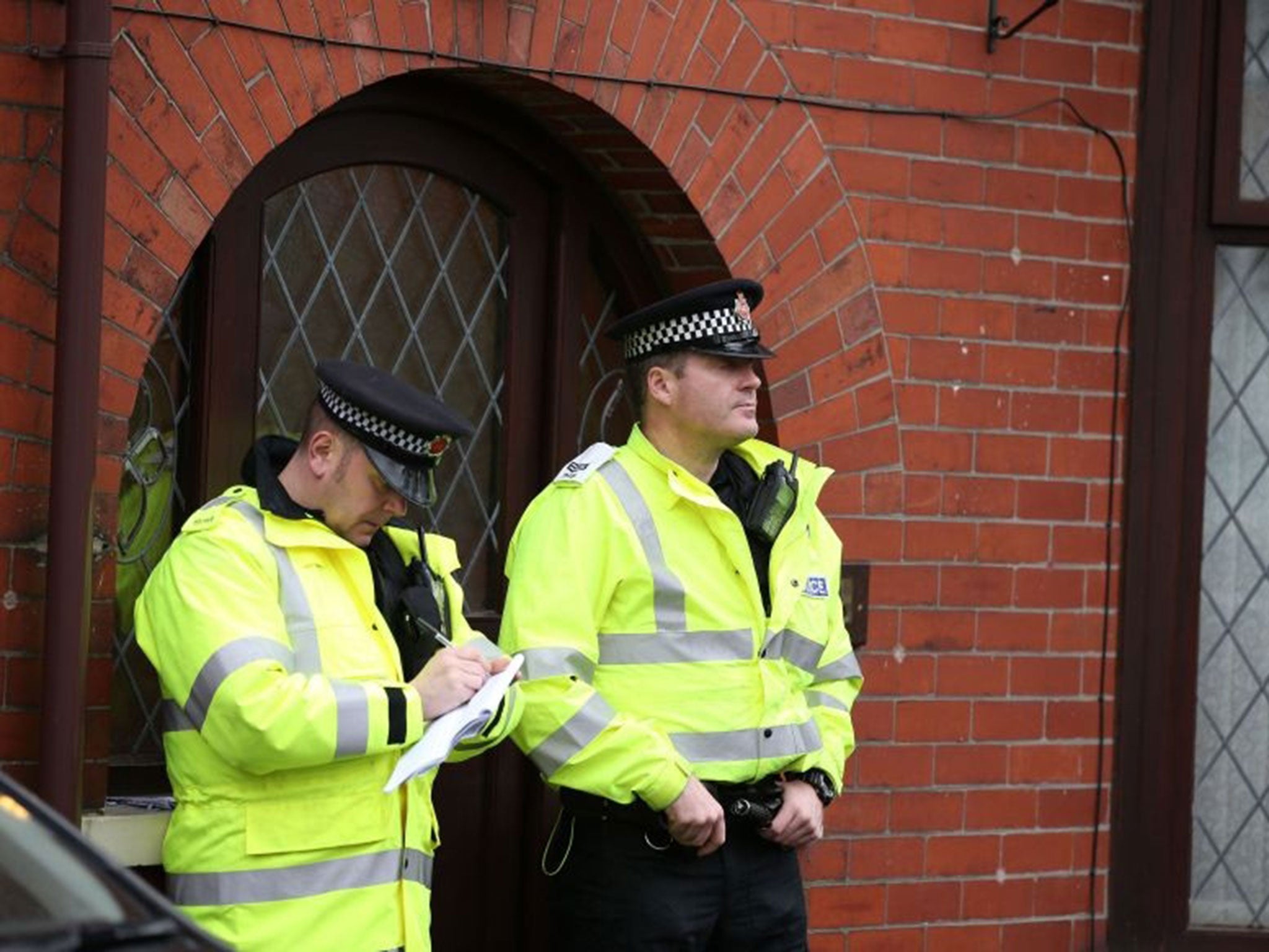 Police outside the home of Labour councillor Shakil Ahmed whose son is one of nine Britons detained in Turkey on suspicion of trying to cross the border into Syria.