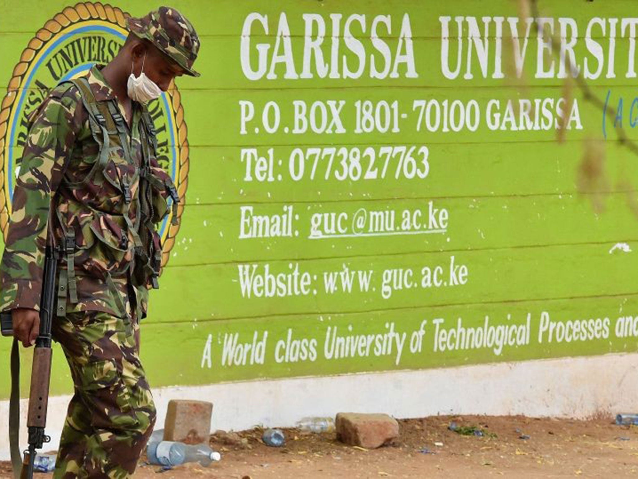 A Kenya Defence forces soldier walks past the front entrance of Garissa University College
