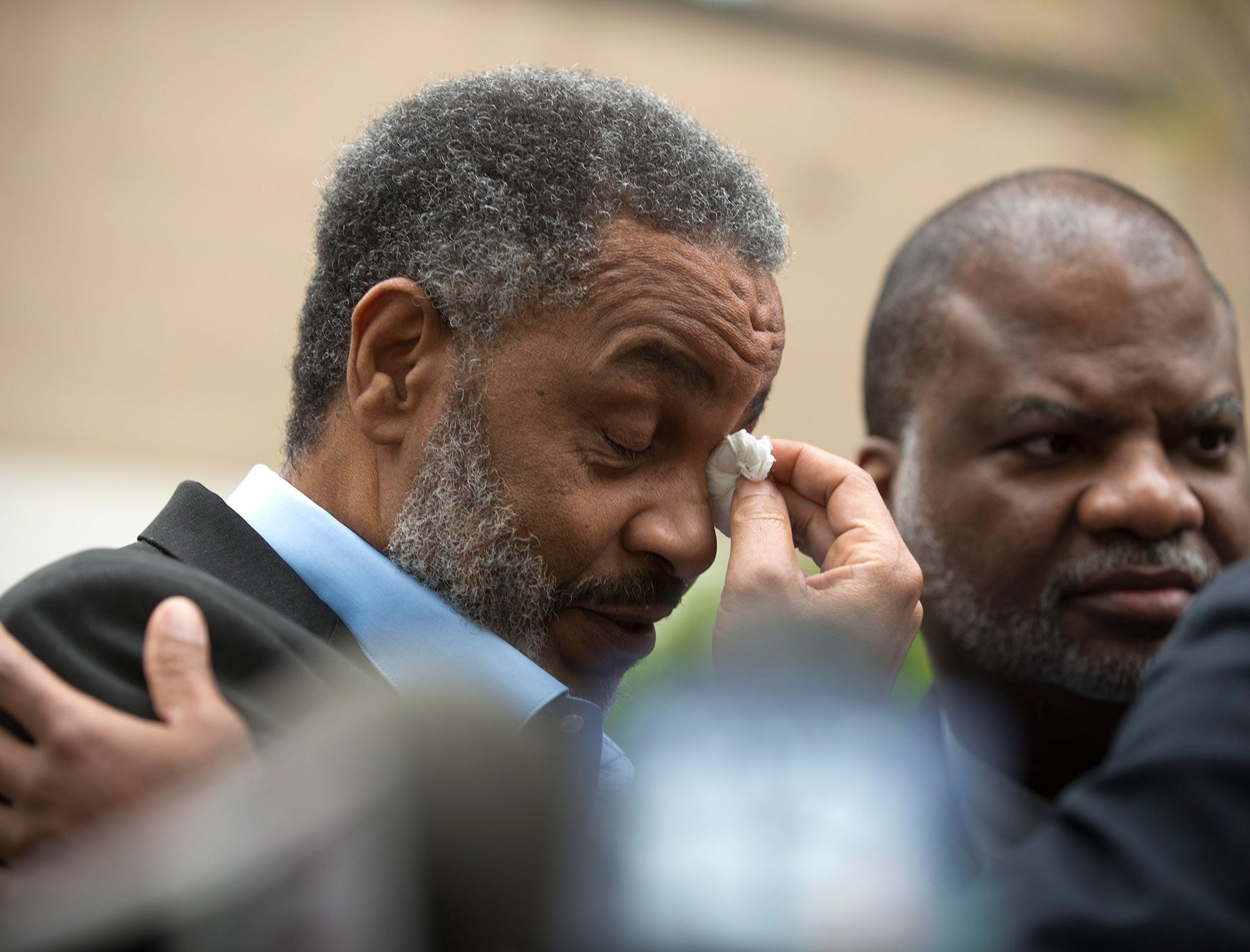 Anthony Ray Hinton wipes away tears outside of the Jefferson County Jail upon his release after serving 28 years on death row, in Birmingham, Alabama