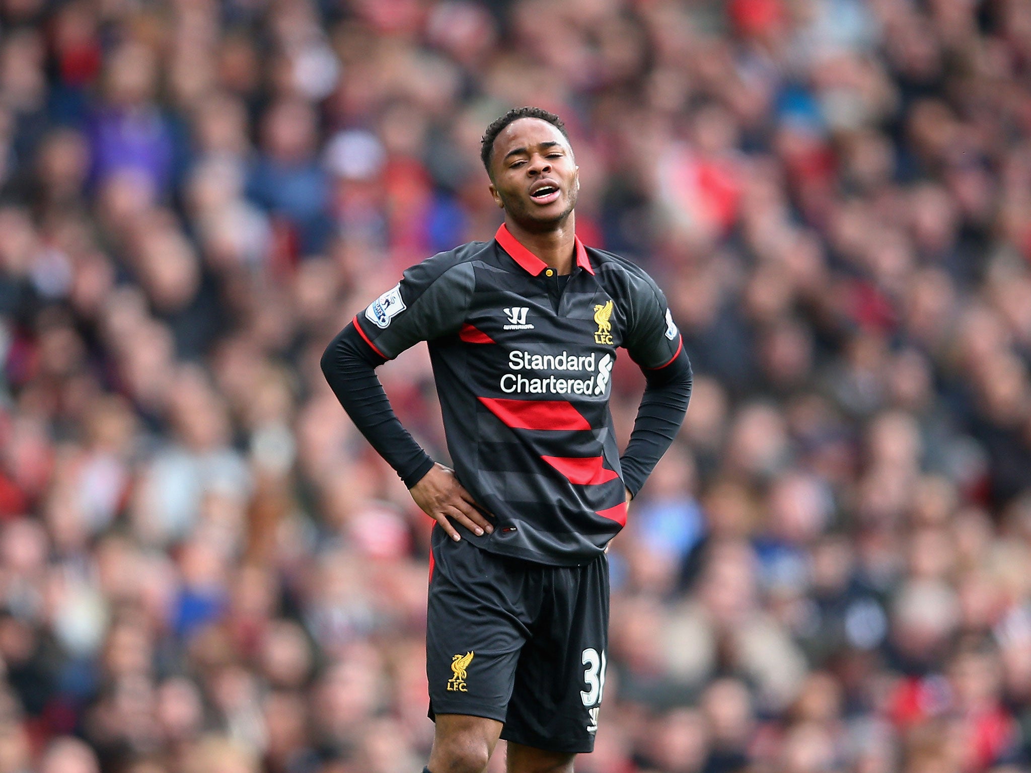 Raheem Sterling reacts in frustration after missing a chance