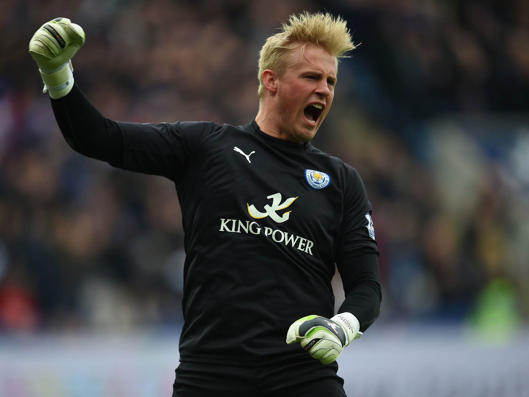 Kasper Schmeichel celebrates Esteban Cambiasso's opener
