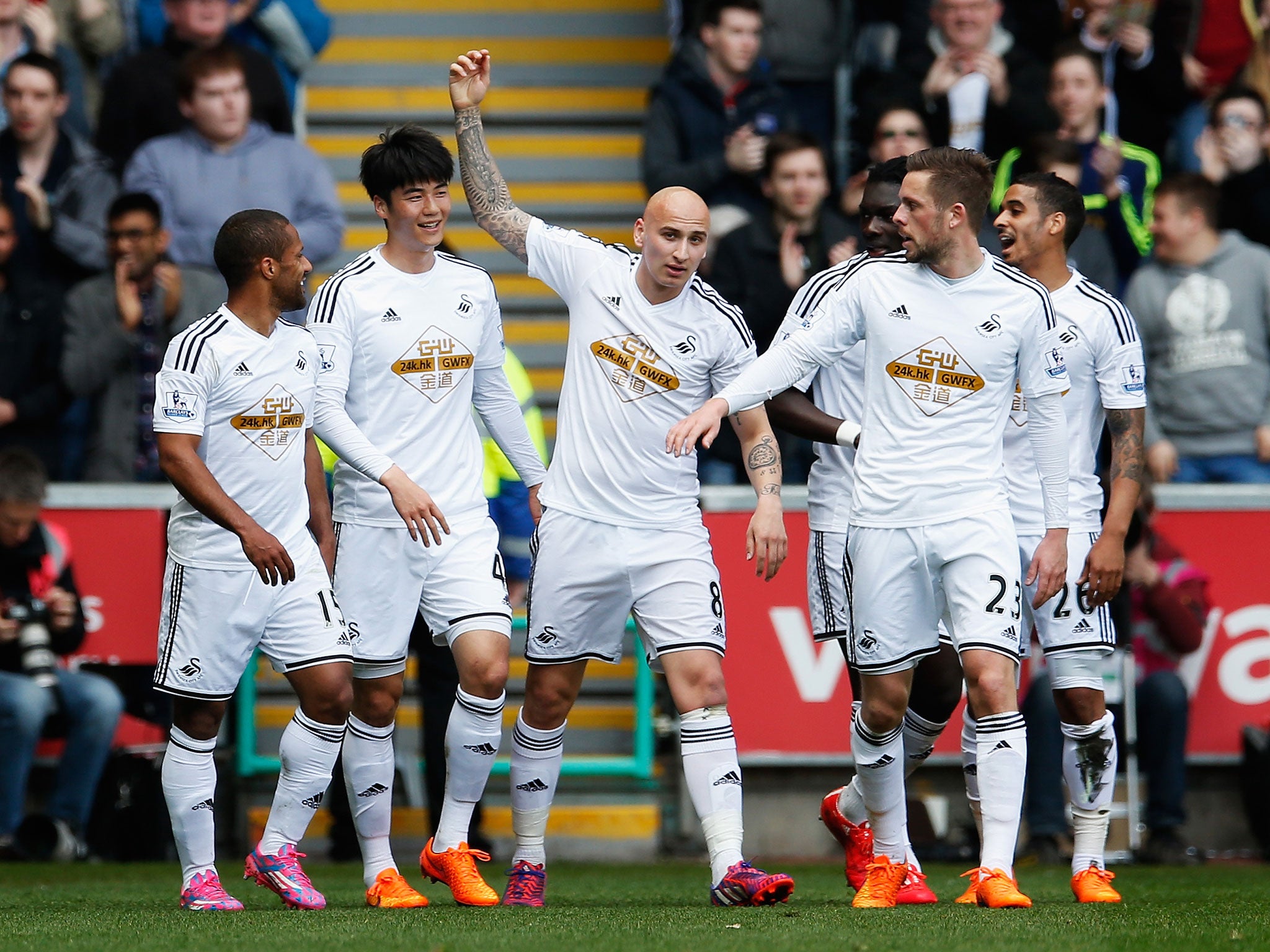 Swansea celebrate after Ki Sung-Yeung opens the scoring