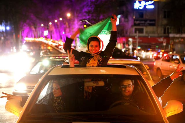 Iranians celebrate in northern Tehran following the announcement of Iran's nuclear agreement with world powers