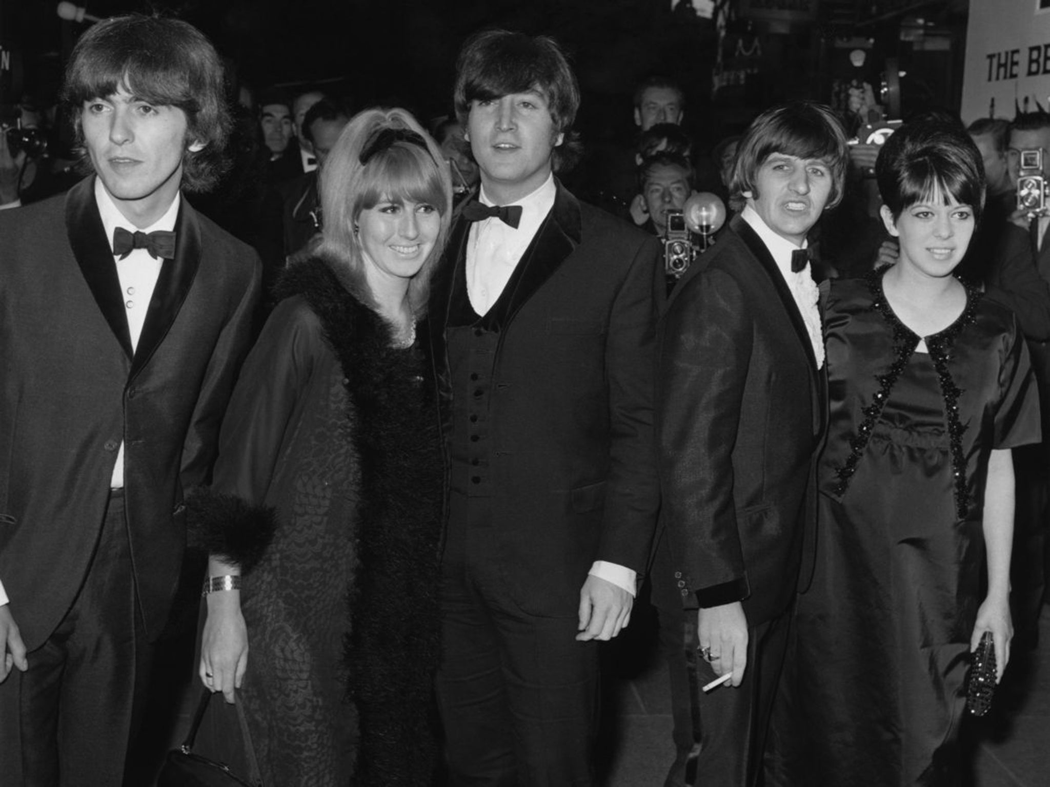 John and Cynthia Lennon, centre, arrive at the 1965 London premiere of the Beatles film Help!