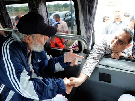 Pictures of the former Cuban president show him shaking hands with supporters