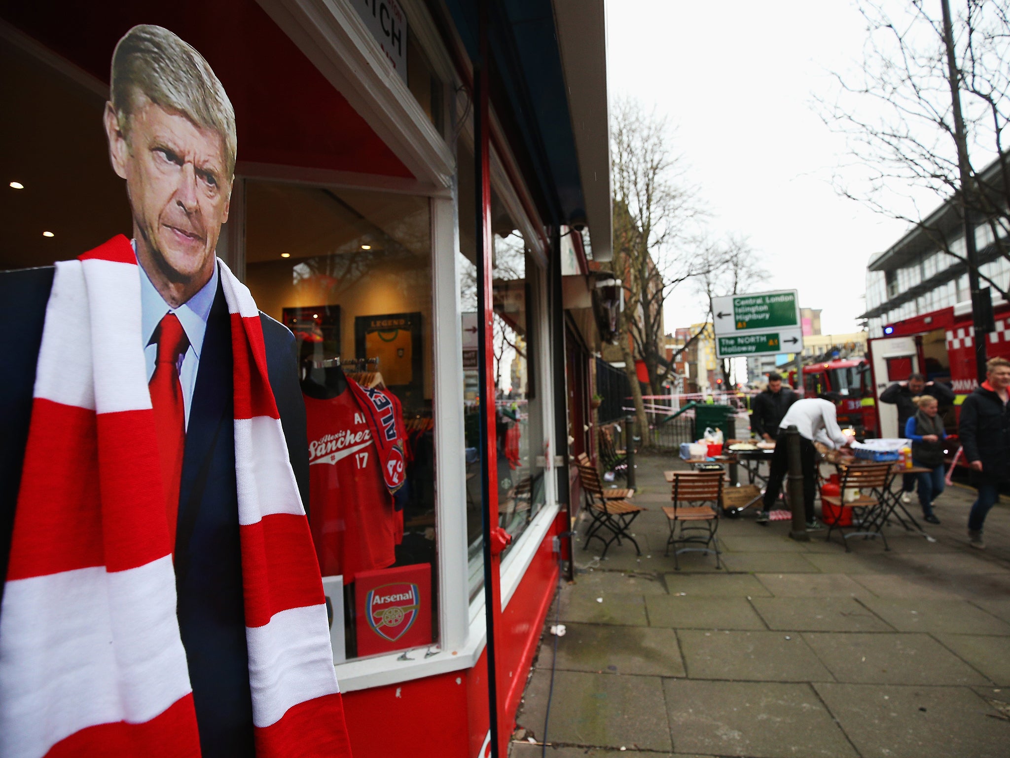 A cardboard cut-out of Arsene Wenger, manager of Arsenal, stands in the doorway of The Match Day shop prior to the Premier League match between Arsenal and Liverpool