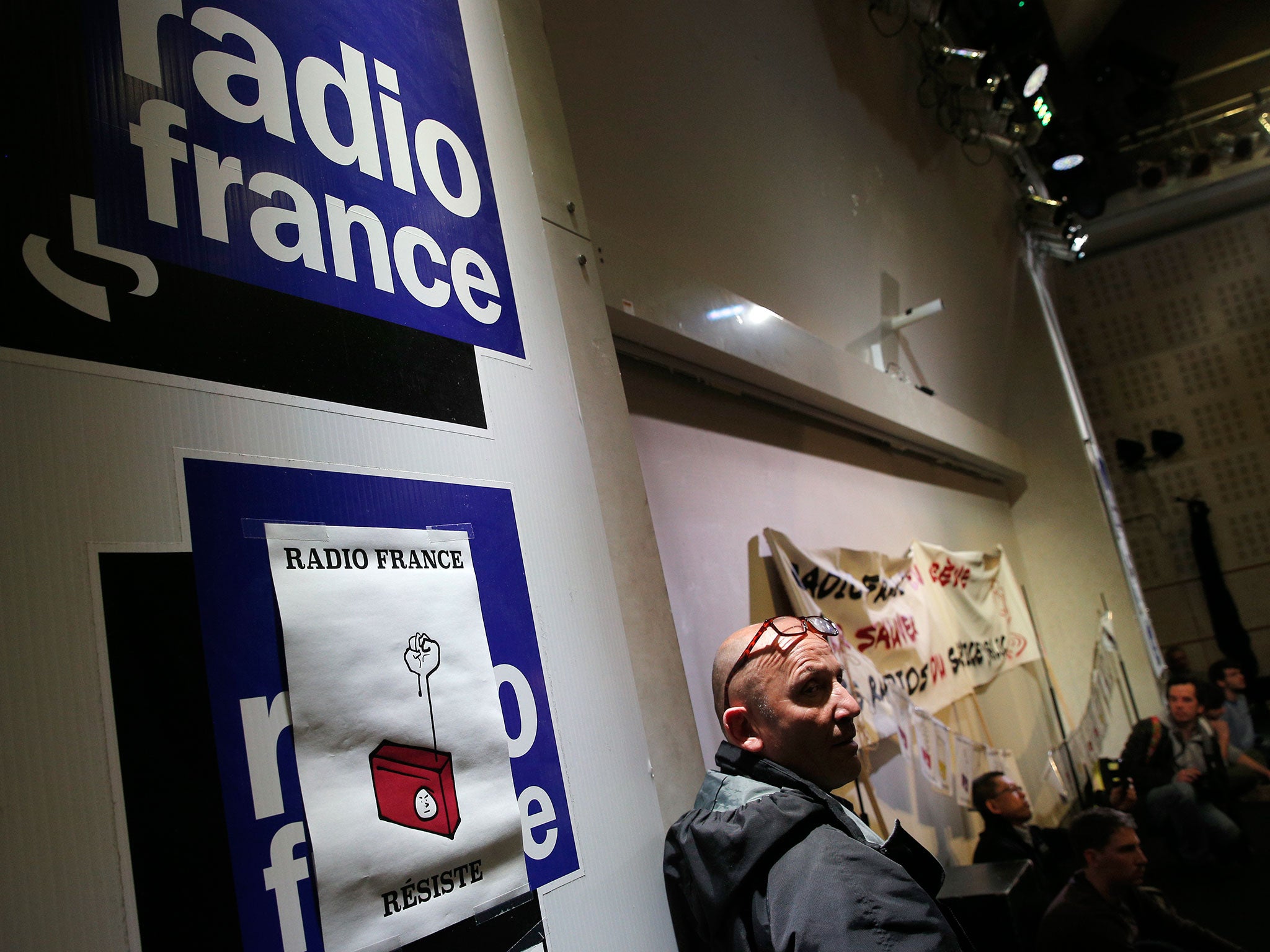 Employees of France's state radio corporation Radio France attend a strike meeting held at the company's headquarters in Paris, France