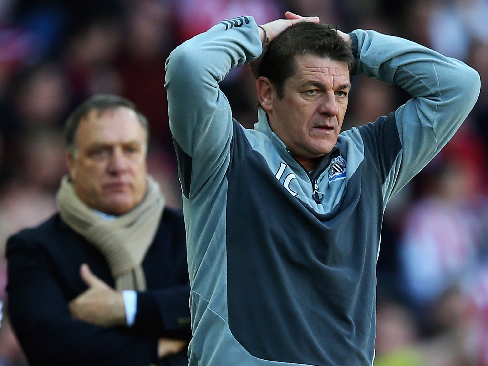 John Carver watches his Newcastle side slip to defeat