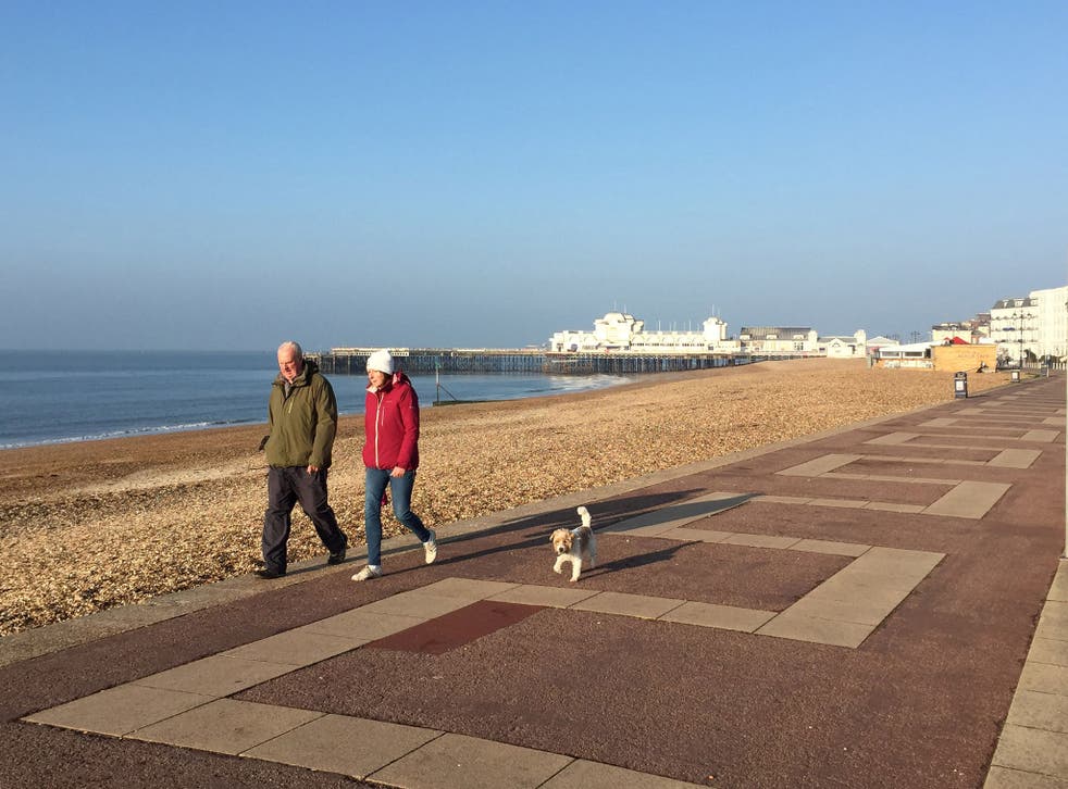 Dog walkers enjoying the sunshine in Southsea, Hampshire as the good Easter weather continues across the UK