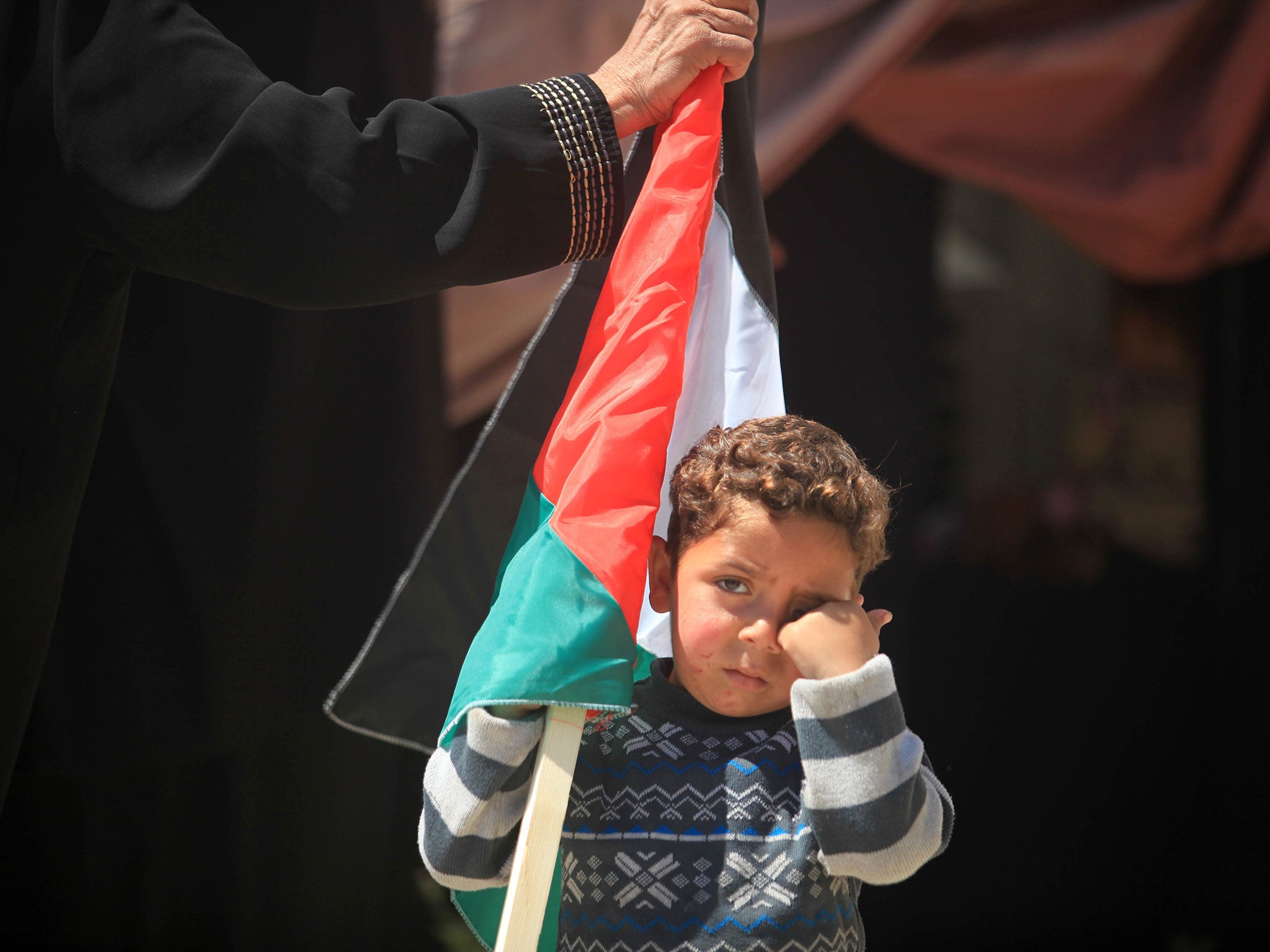A Palestinian child pictured during a gathering in front of the UN headquarters in Gaza City in solidarity with Palestinians living in Syria's Yarmouk camp (6 April, 2015)