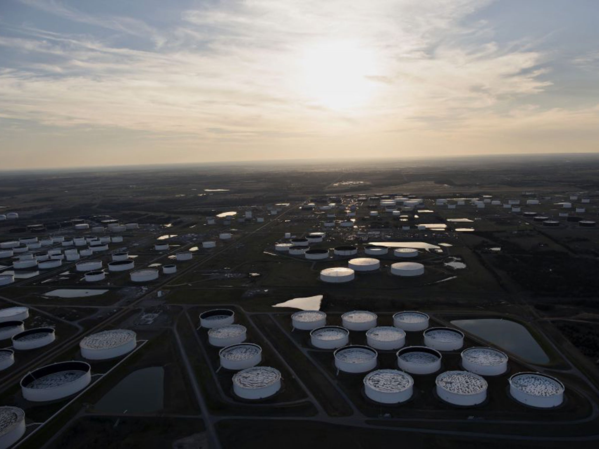 Oil storage tanks in Cushing, Oklahoma, located at the convergence of several pipelines; the number of earthquakes above 3.0 on the Richter scale has risen from two in 2008 to 585 in 2014