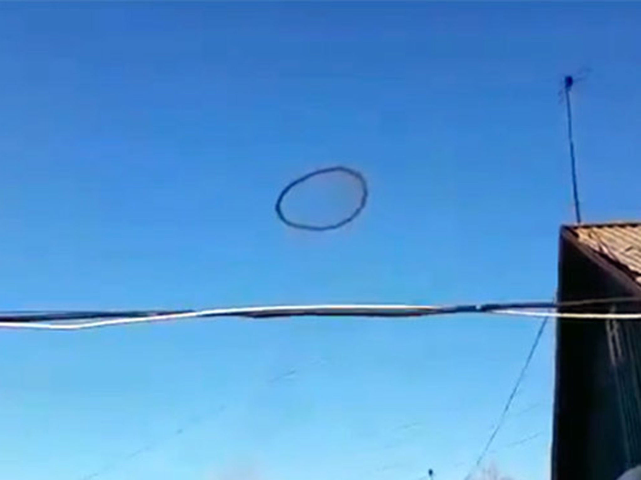 The black circle filmed above a house in the Kazakh village of Shortandy (Ruptly)