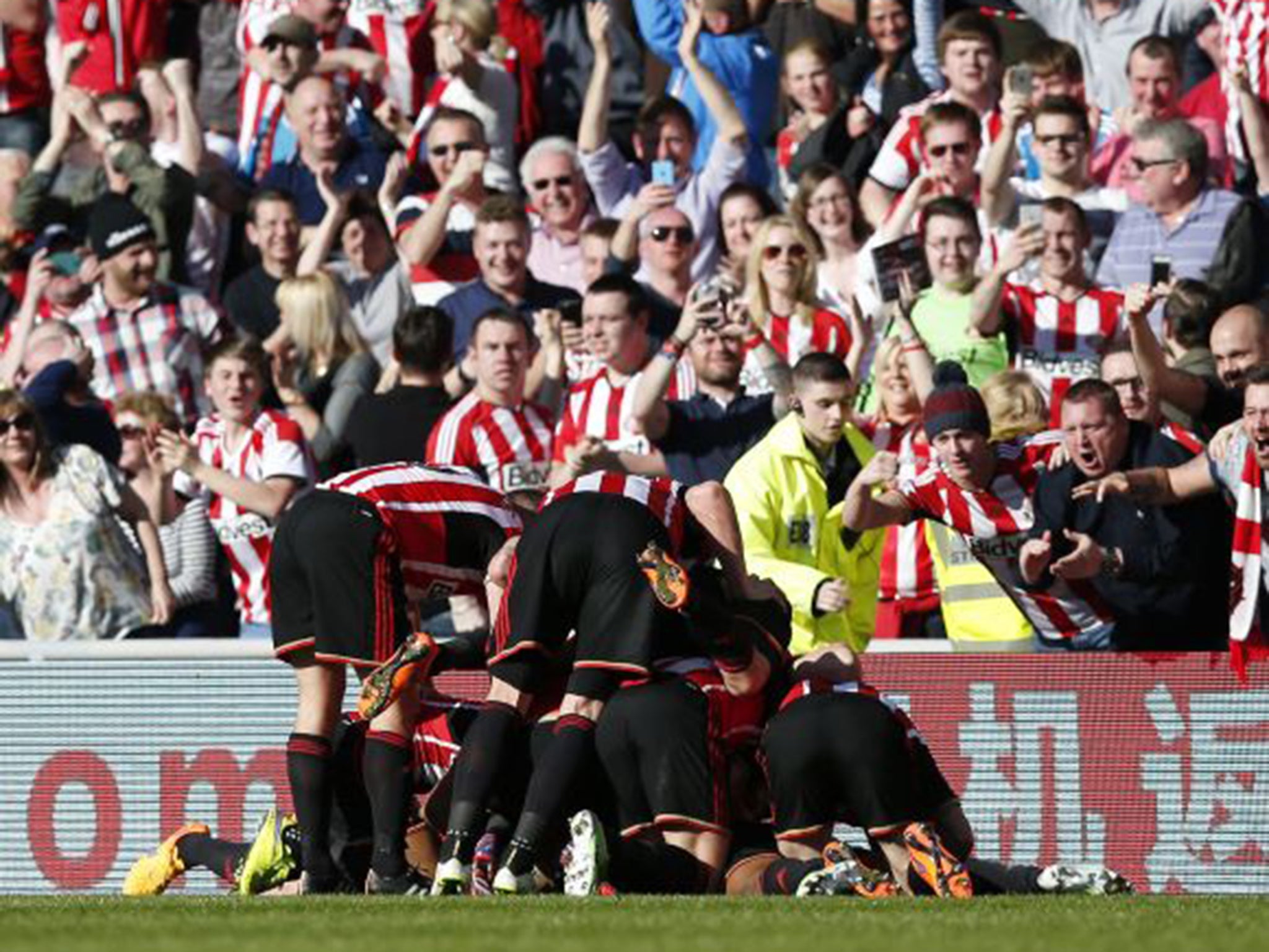 Sunderland players pile on top of Jermain Defoe after his wonder winner against Newcastle on Sunday