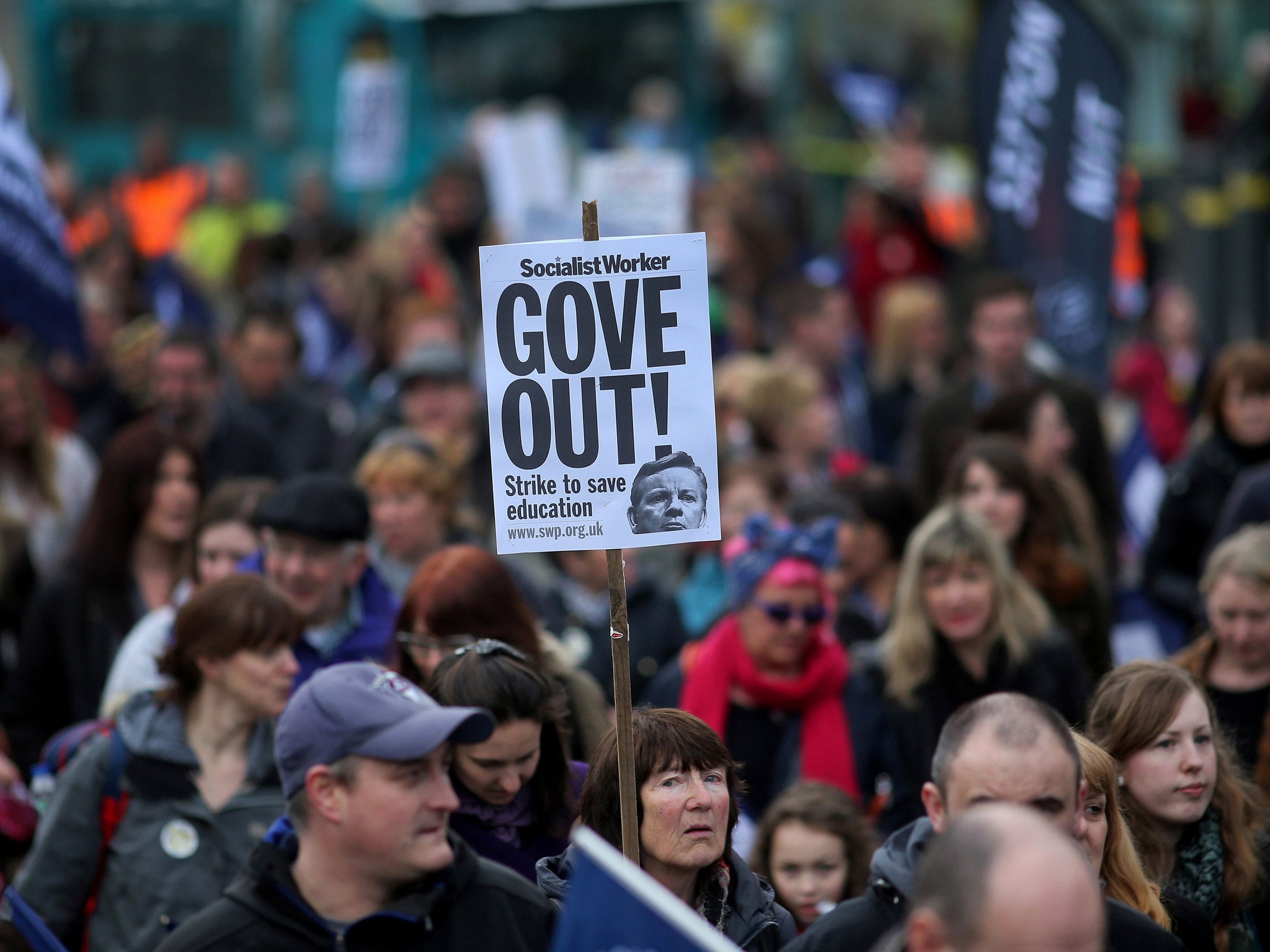 Members of the National Union of Teachers (NUT) take part in a rally during a one-day walkout by teachers across England and Wales in March last year