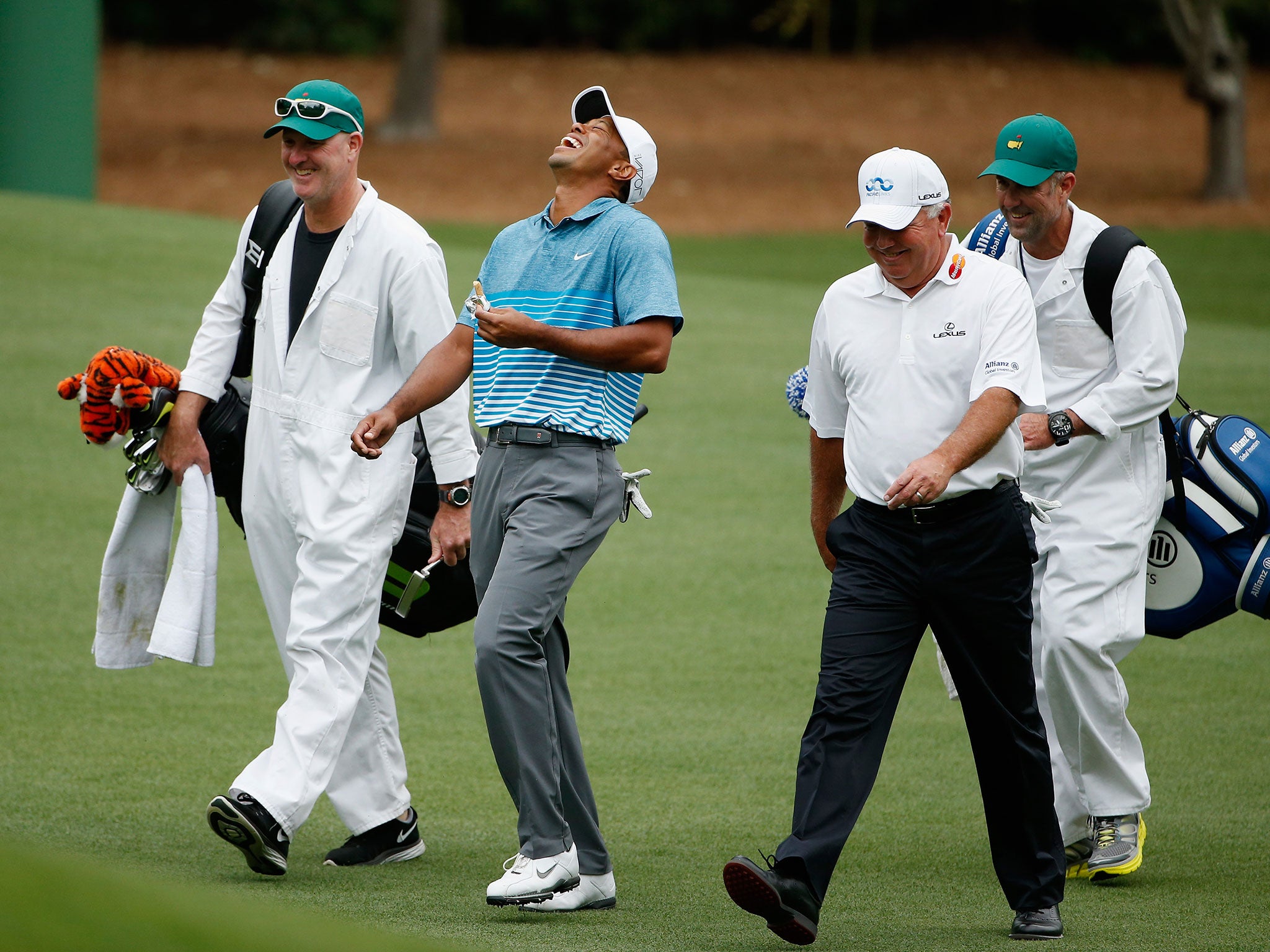 Tiger Woods jokes during a practice round at Augusta