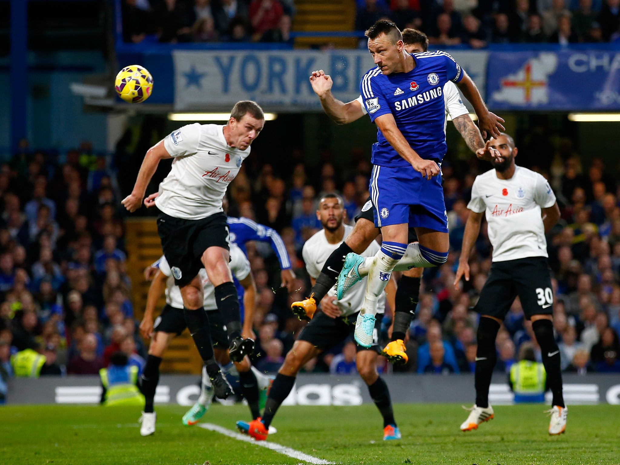 Chelsea captain John Terry heads in a goal against QPR earlier this season