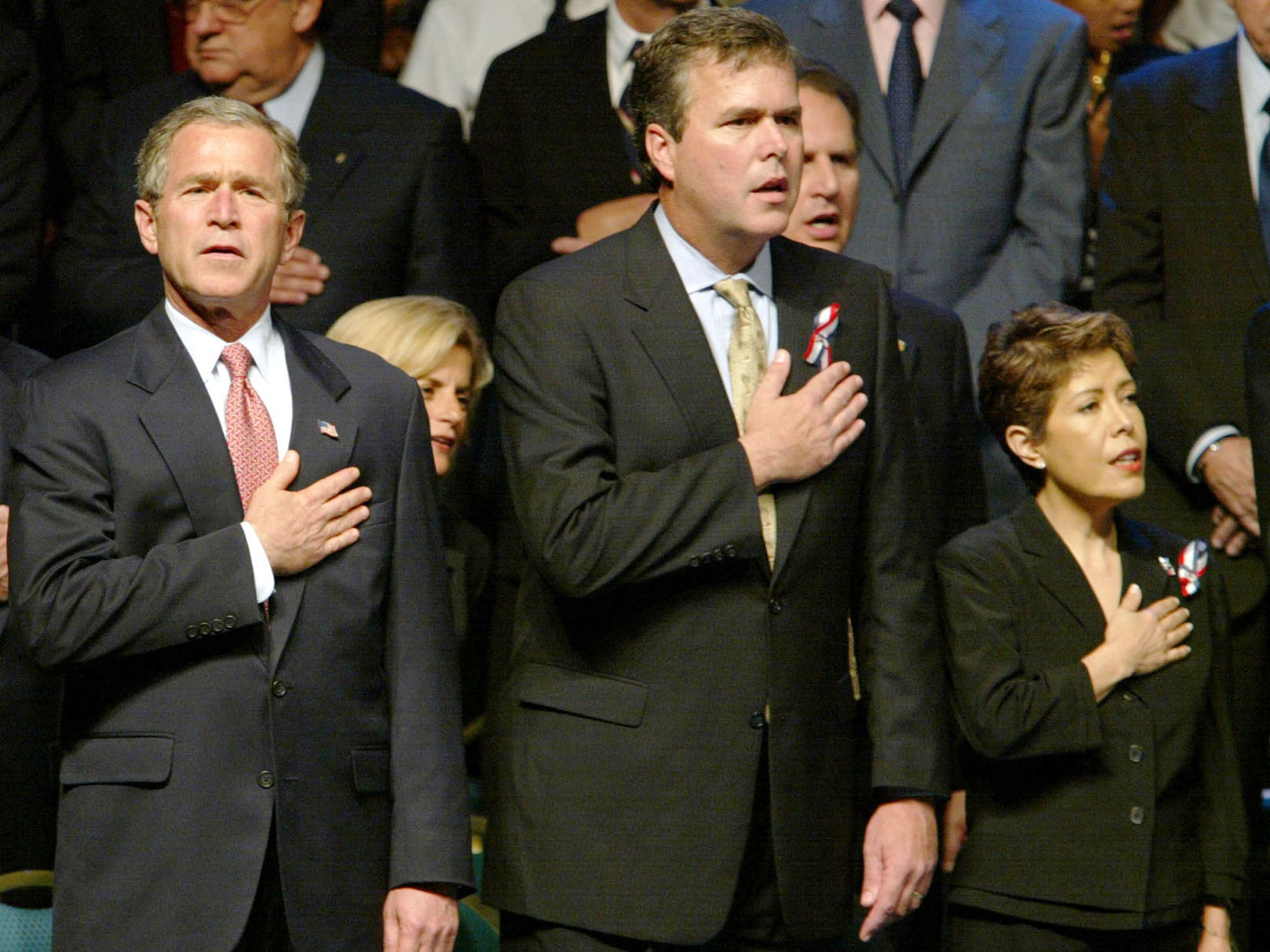 Jeb and Columba Bush with George W in 2002 (Getty)