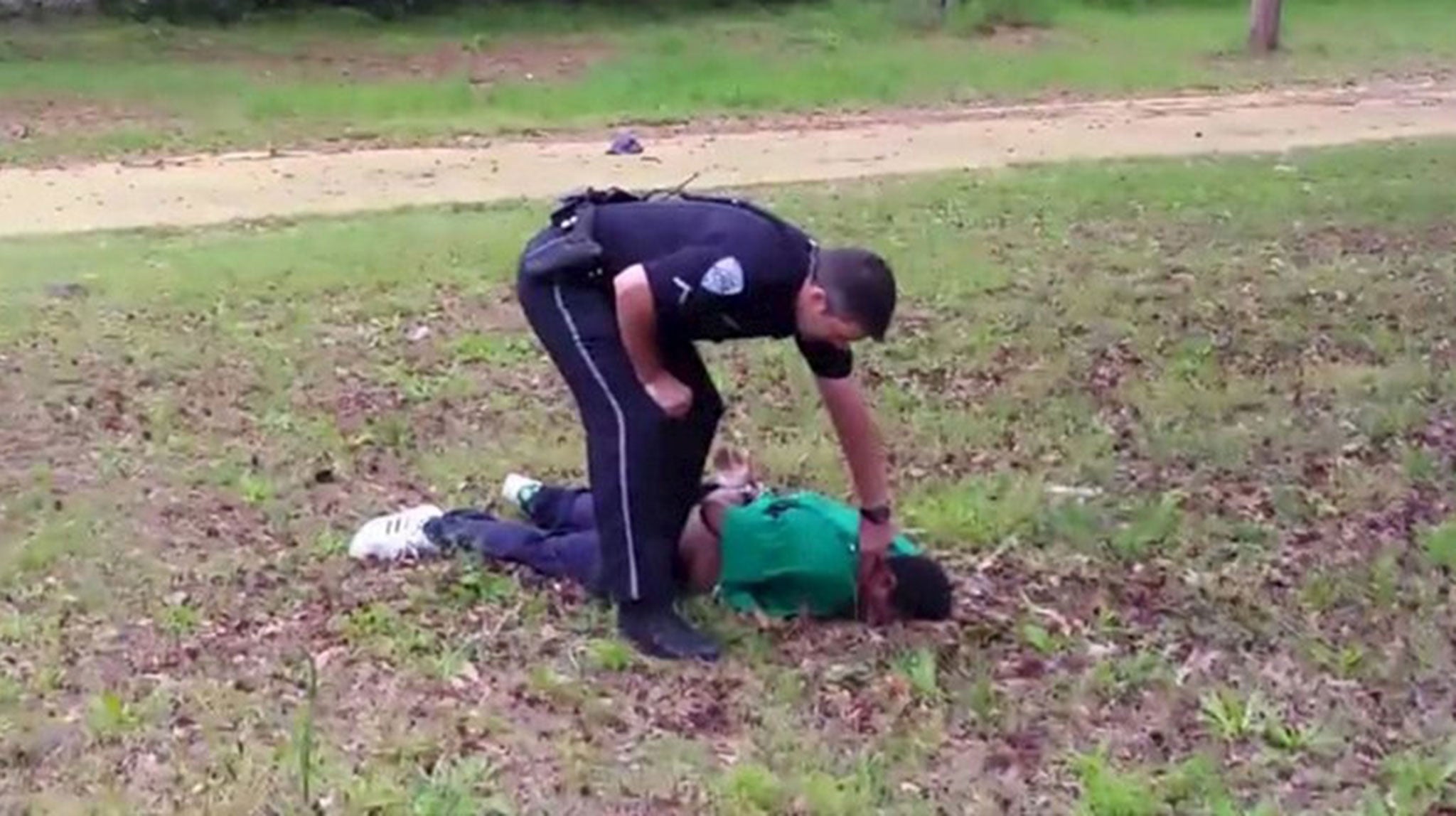Slager stands over Scott right after the shooting