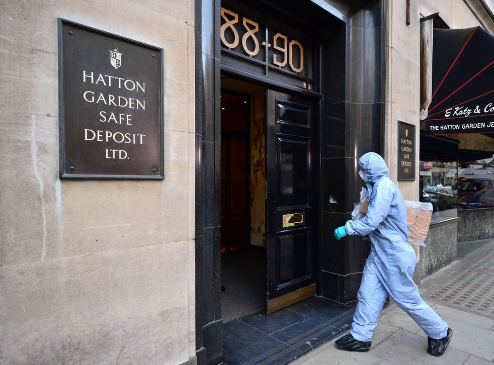 A police forensics officer entering the Hatton Garden Safe Deposit company in London, as detectives continued to determine the scale of a heist at a safety deposit centre as victims hope to learn whether their jewels and cash are among the "huge" haul sto