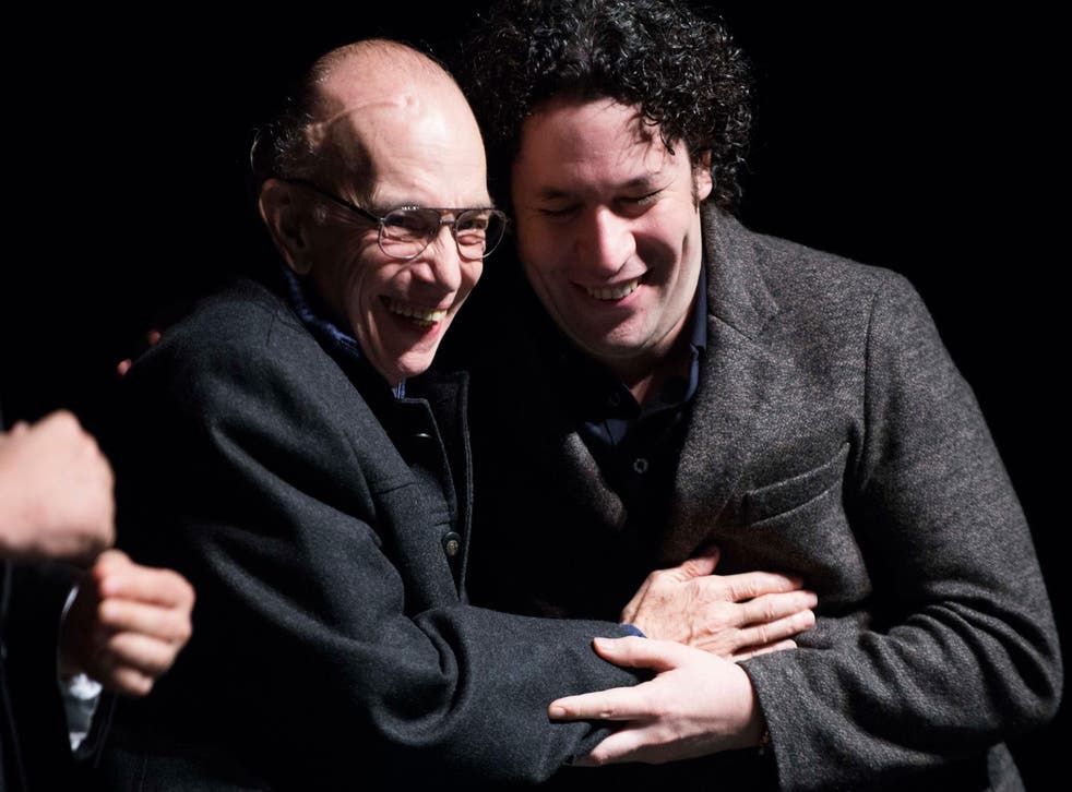 Gustavo Dudamel (right) embraces his mentor and El Sistema founder Jose Antonio Abreu