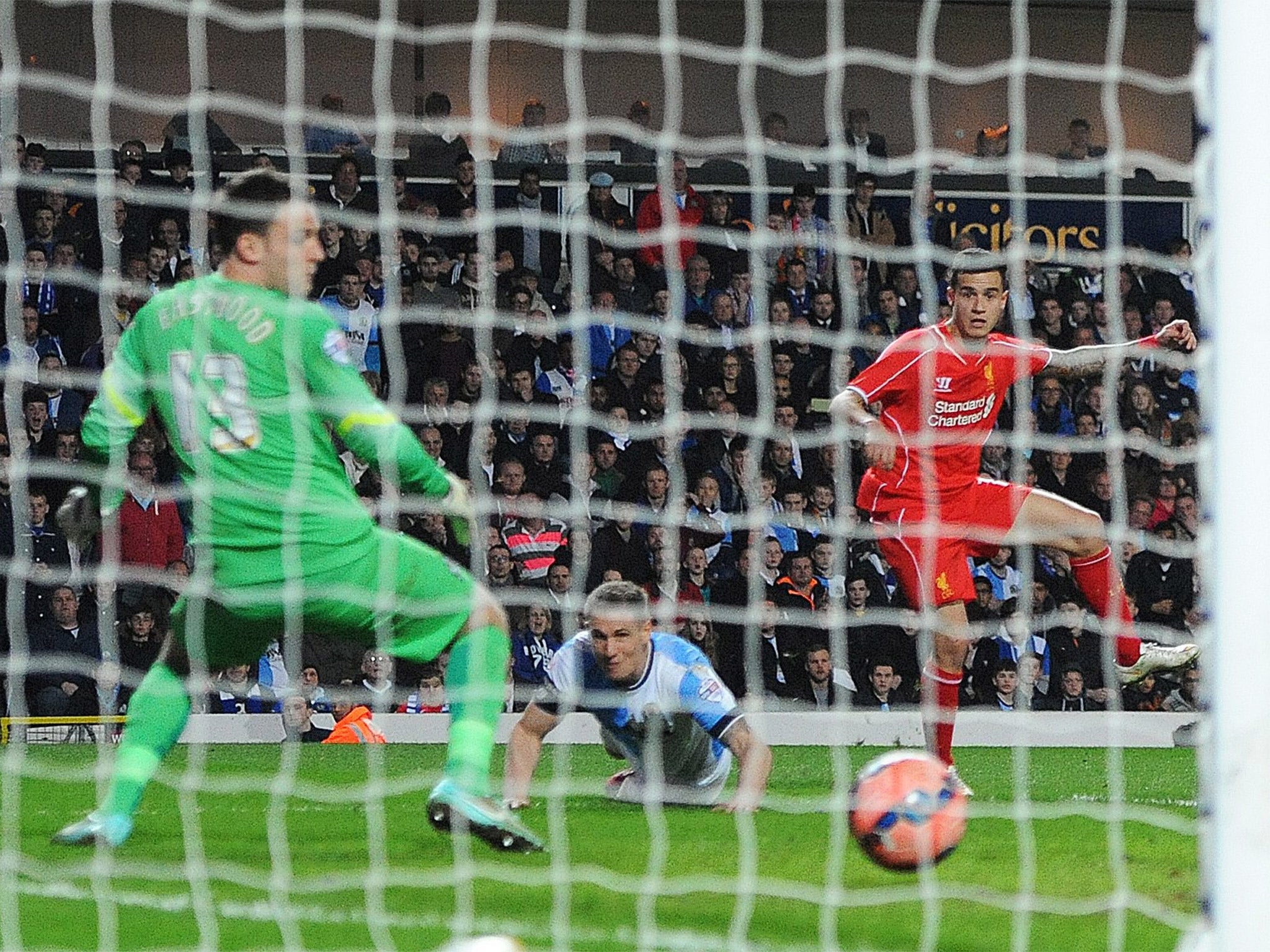 Philippe Coutinho finds the bottom corner to book Liverpool's place in the semis