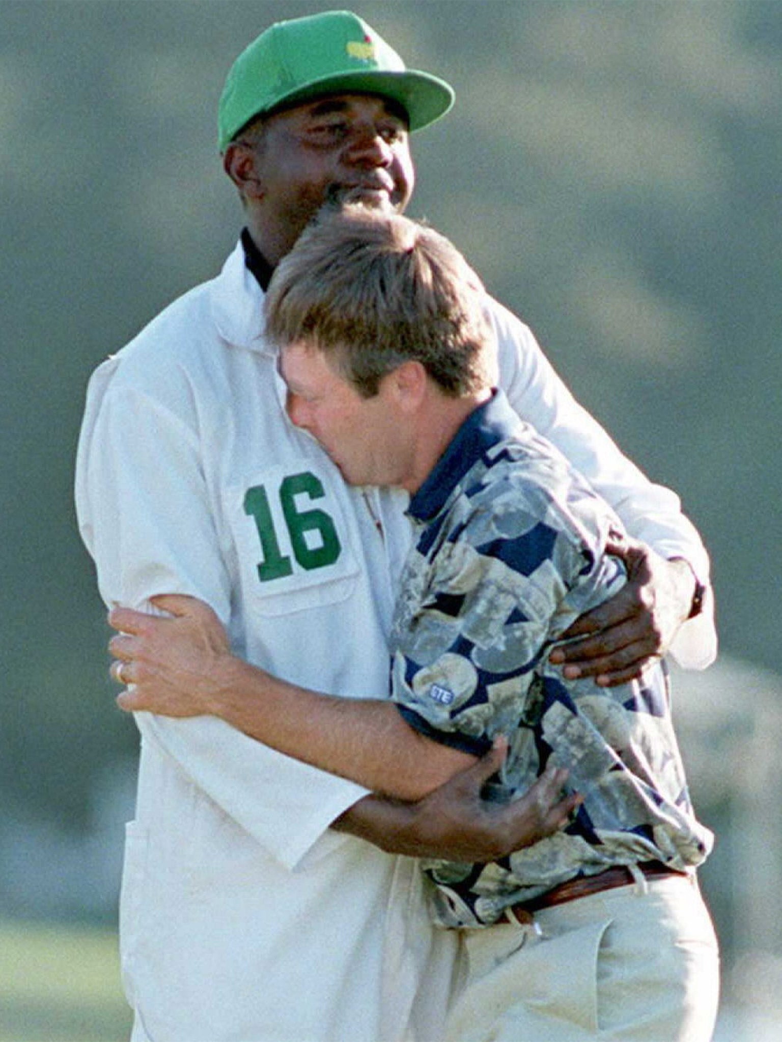 Ben Crenshaw hugs Carl Jackson on the 18th green after winning the 1995 tournament (Getty)