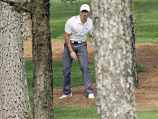 Woods's return grips Augusta but McIlroy eyes destiny