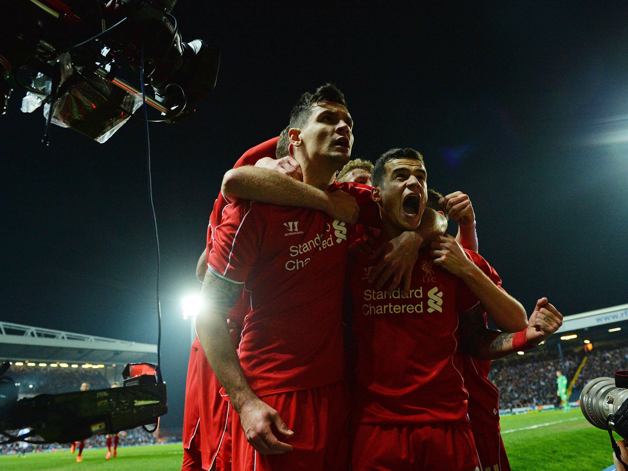 Liverpool players celebrate Philippe Coutinho's winner