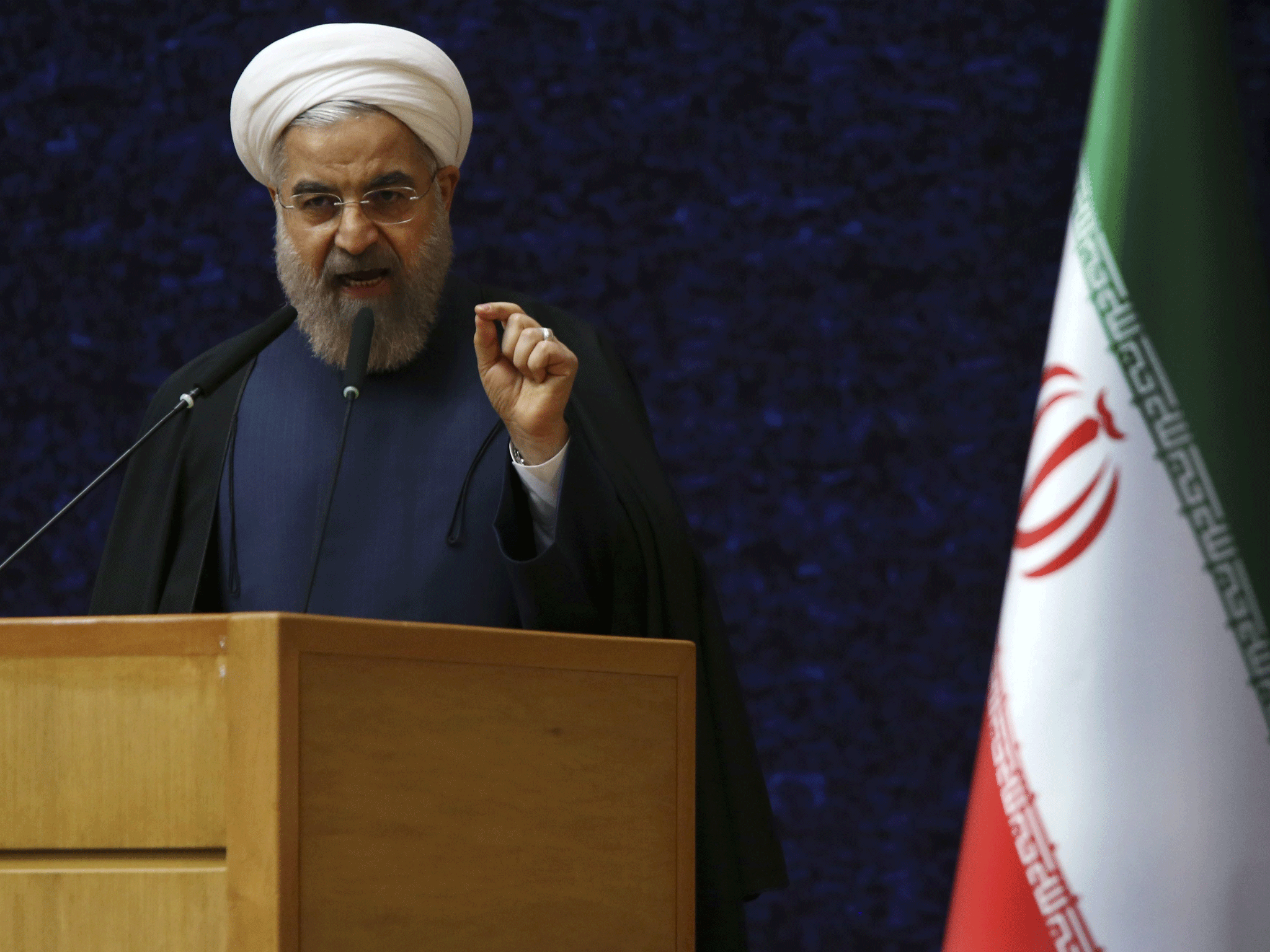 Iranian President Hassan Rouhani delivers his speech in a ceremony marking National Nuclear Technology Day, in Tehran, Iran, Thursday, April 9, 2015