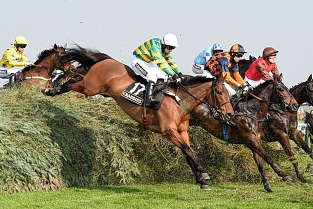 On The Fringe (No 17), ridden by Nina Carberry, clears The Chair en route to winning the Fox Hunter’s Chase at Aintree 