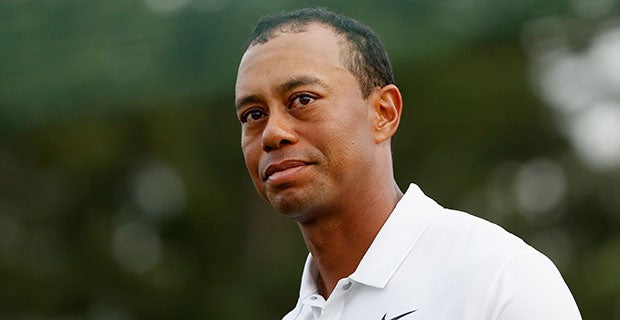 Tiger Woods faces the crowd after his opening round of 73 at the Masters