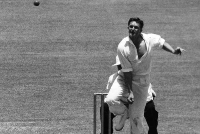 Richie Benaud bowls during the New Year's Day match in Sydney in 1958
