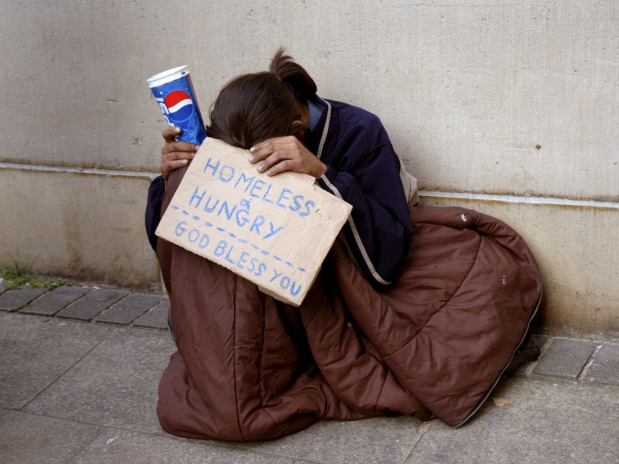A woman begging on the streets of London