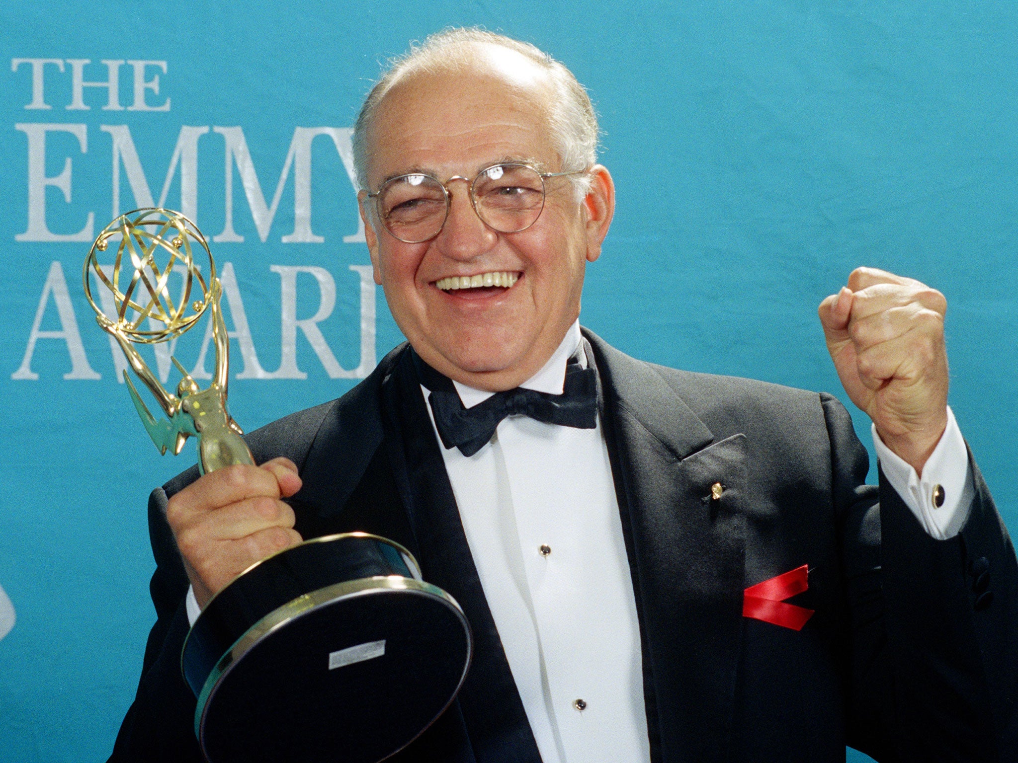 Richard Dysart grasps the Emmy Award he won for Best Supporting Actor in a Drama Series for his role in L.A. Law during the 44th annual Emmy Awards in Pasadena