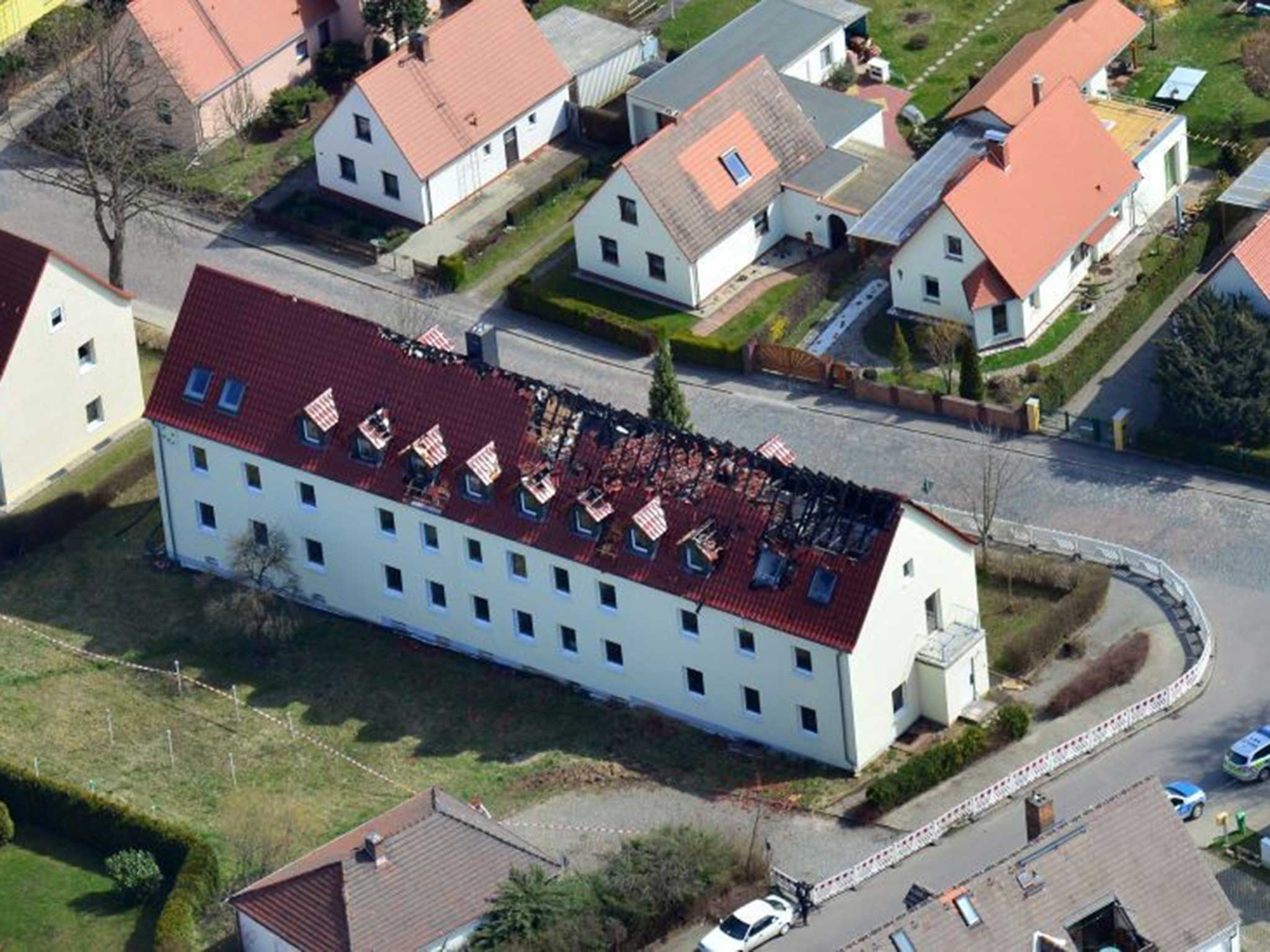 The fire-damaged roof of the hostel in Tröglitz