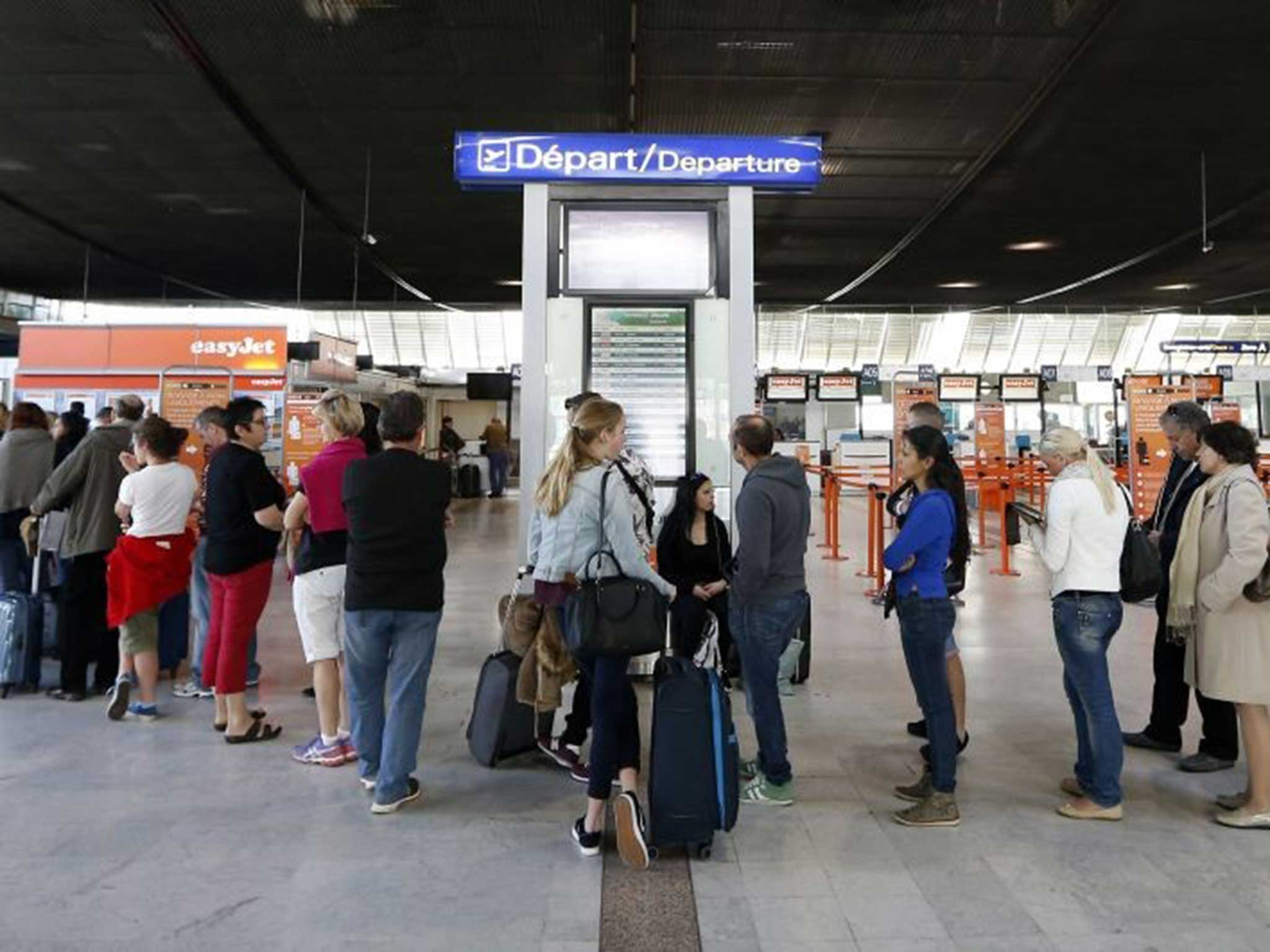 People queue at Nice's airport, southeastern France