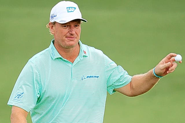 Ernie Els signals to the gallery after a birdie on the second hole