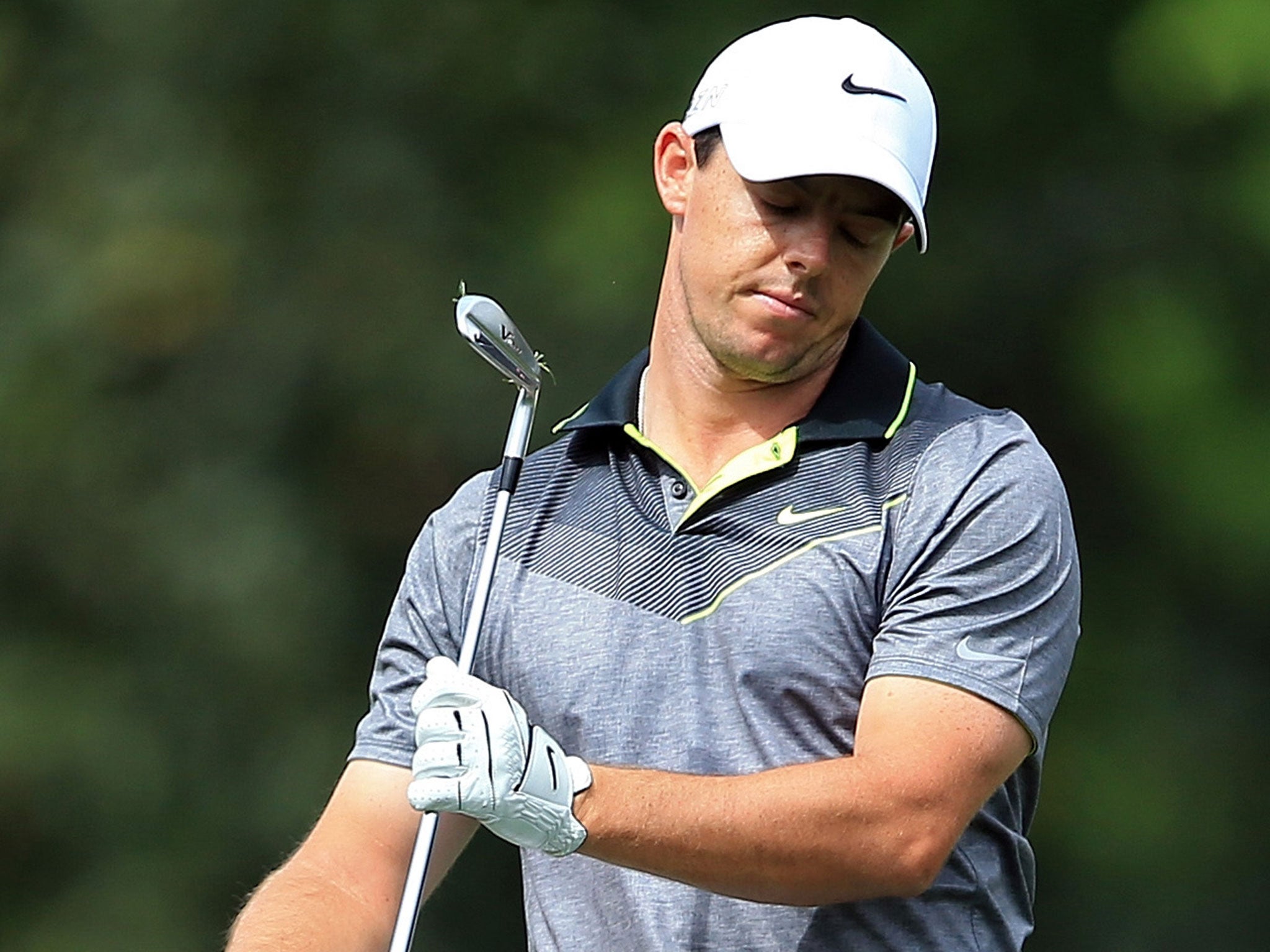 Rory McIlroy reacts to a poor shot on the fifth