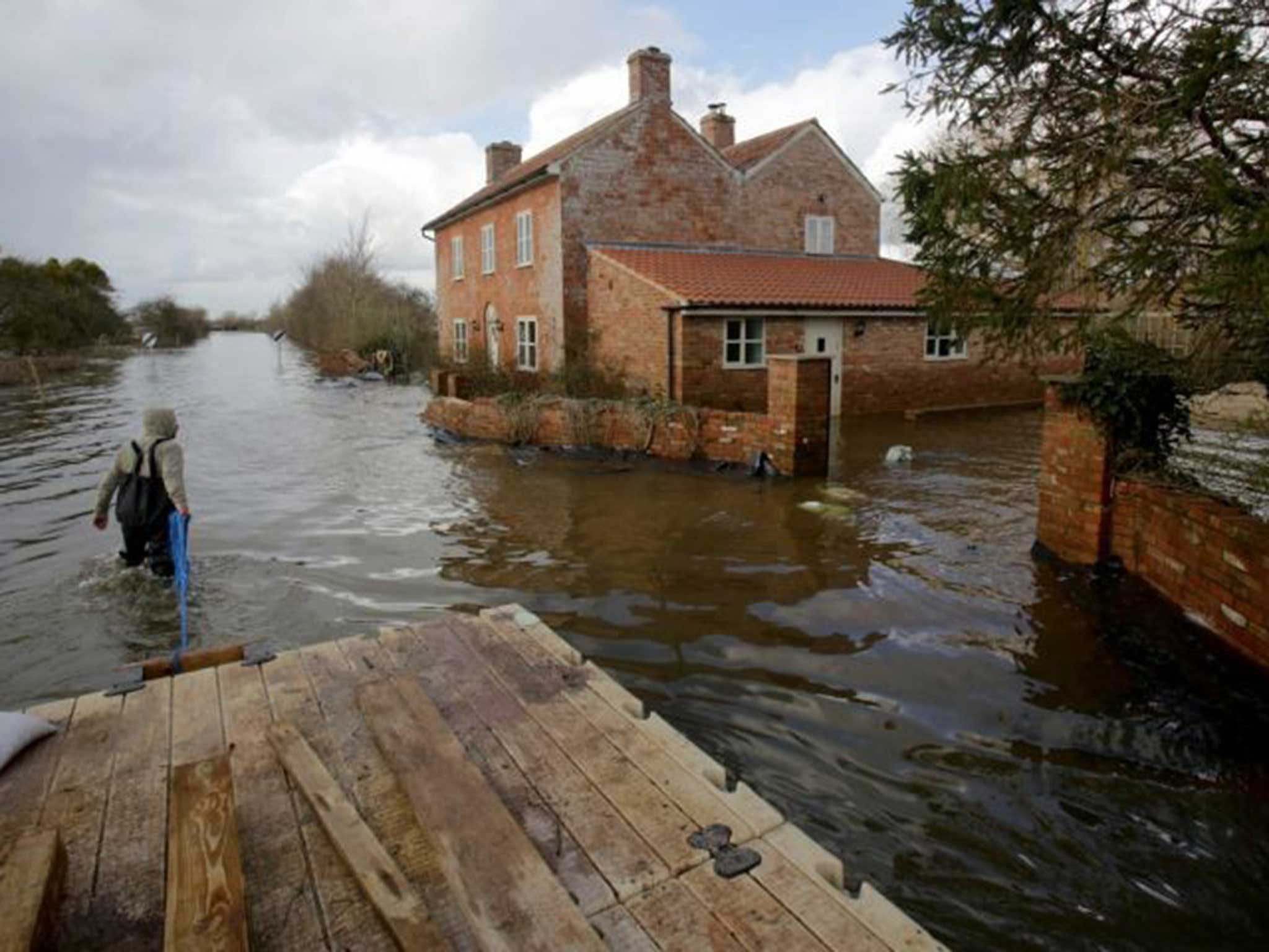 Flood waters in Somerset. New arrangements for cover will have to wait until after the election