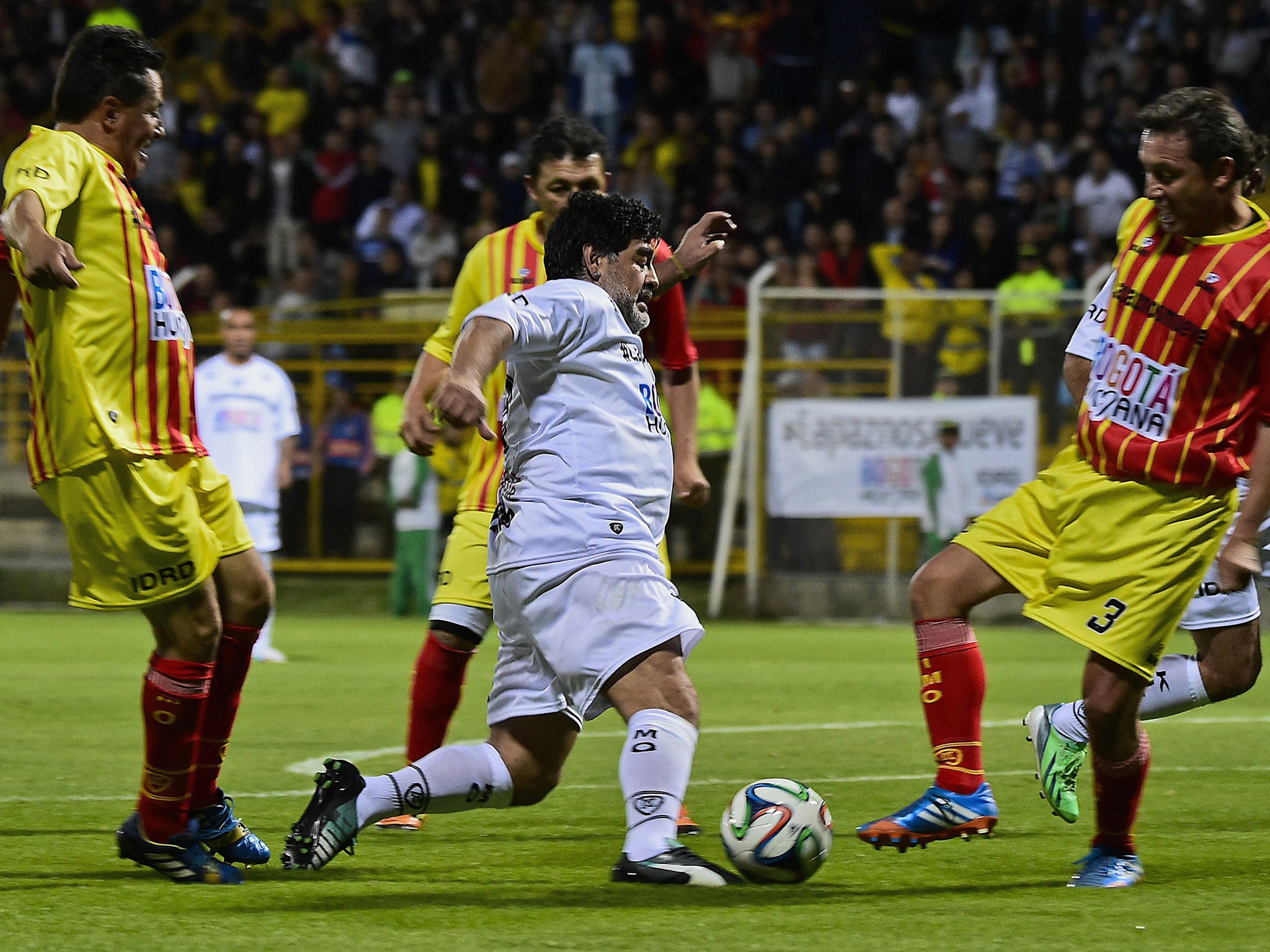 Diego Maradona takes on three men in Colombia's 'Game For Peace'