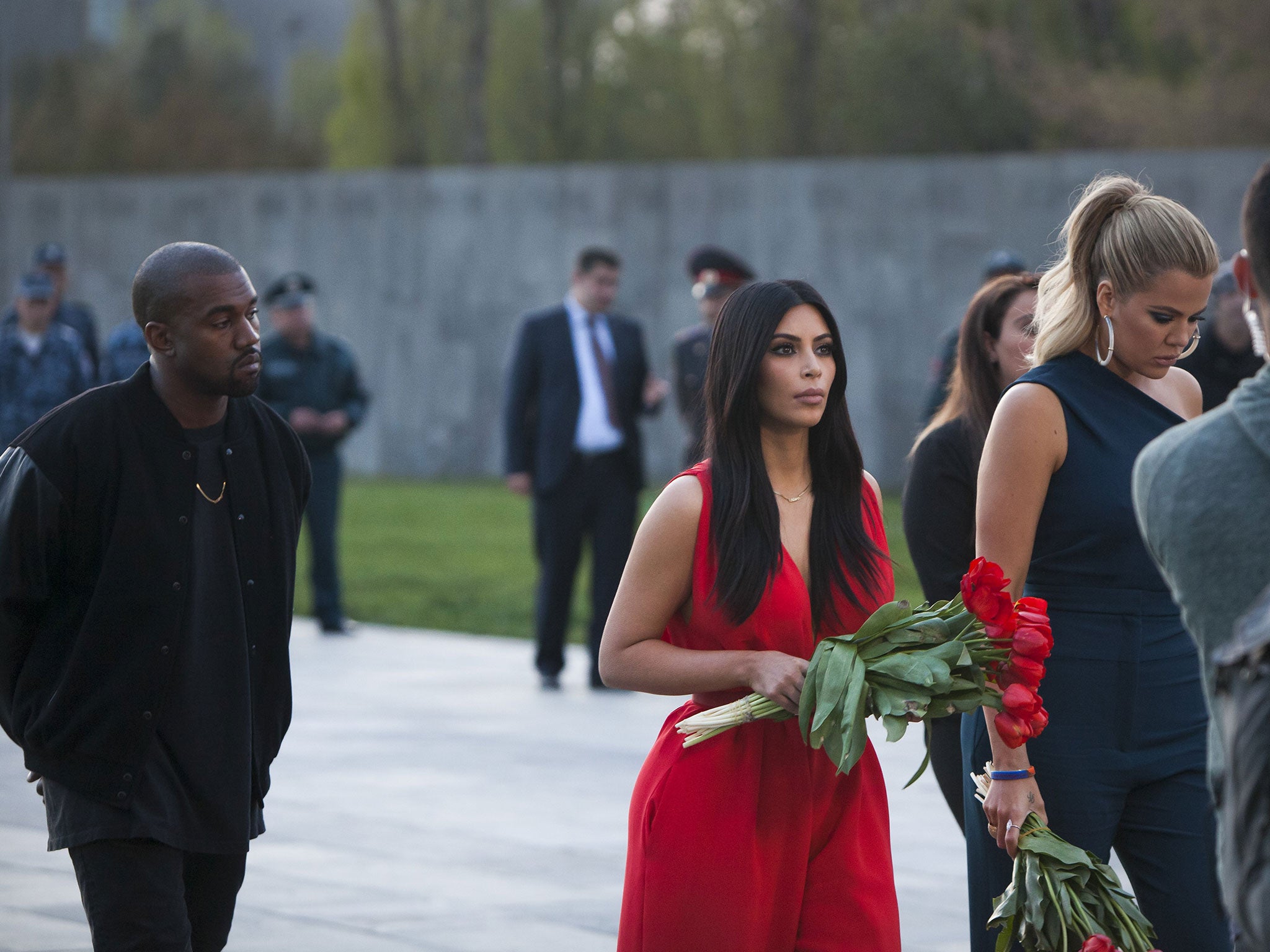Kim Kardashian (L) and her sister Khloe (3rdL) visit the genocide memorial, which commemorates the 1915 mass killing of Armenians in the Ottoman Empire