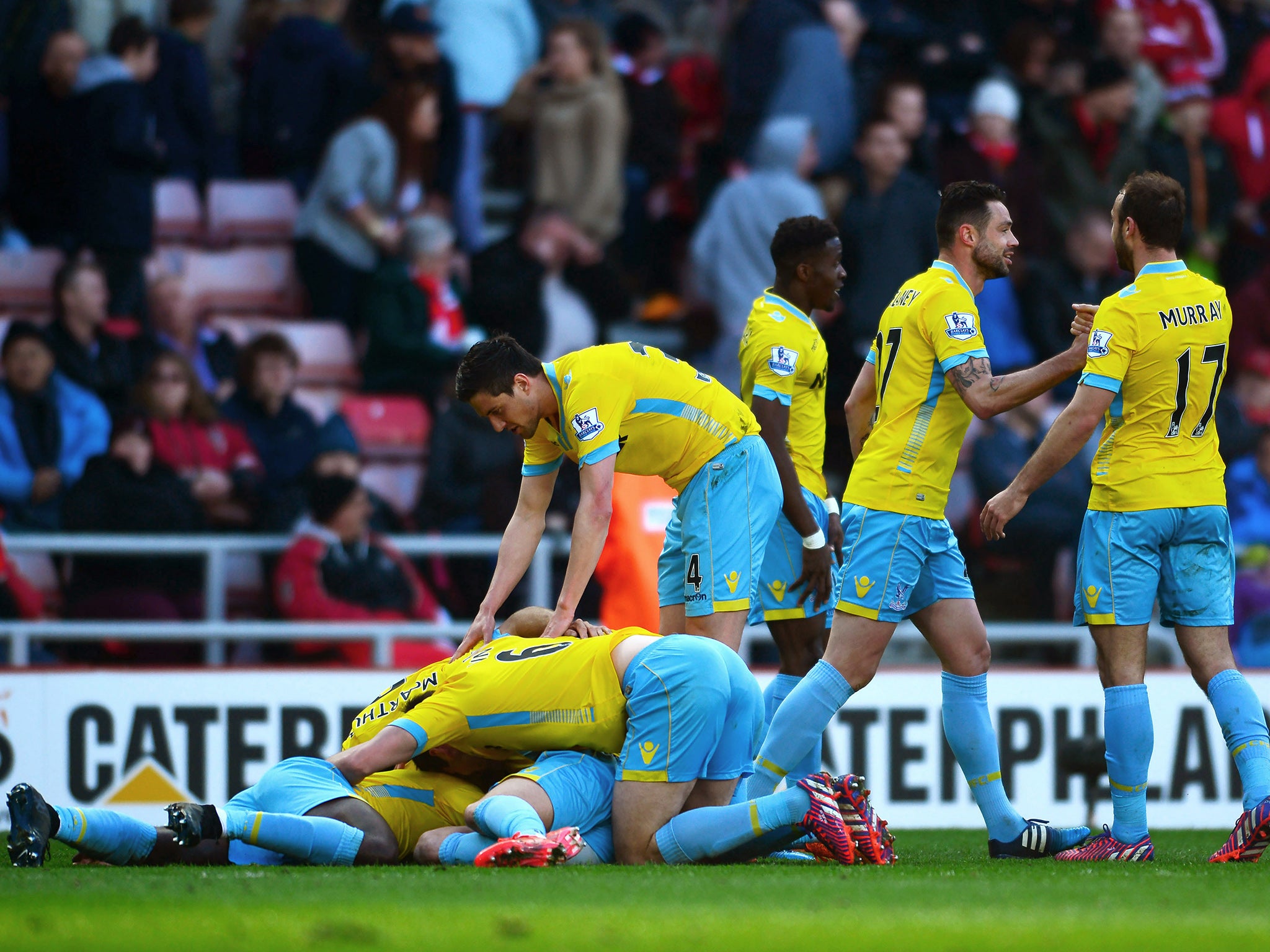 Bolasie is mobbed by team-mates after scoring his third