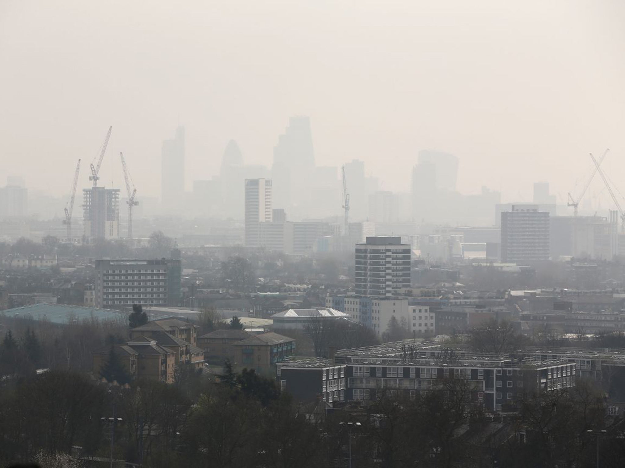 Smog blanketed much of central and southern England on Friday, including the City of London